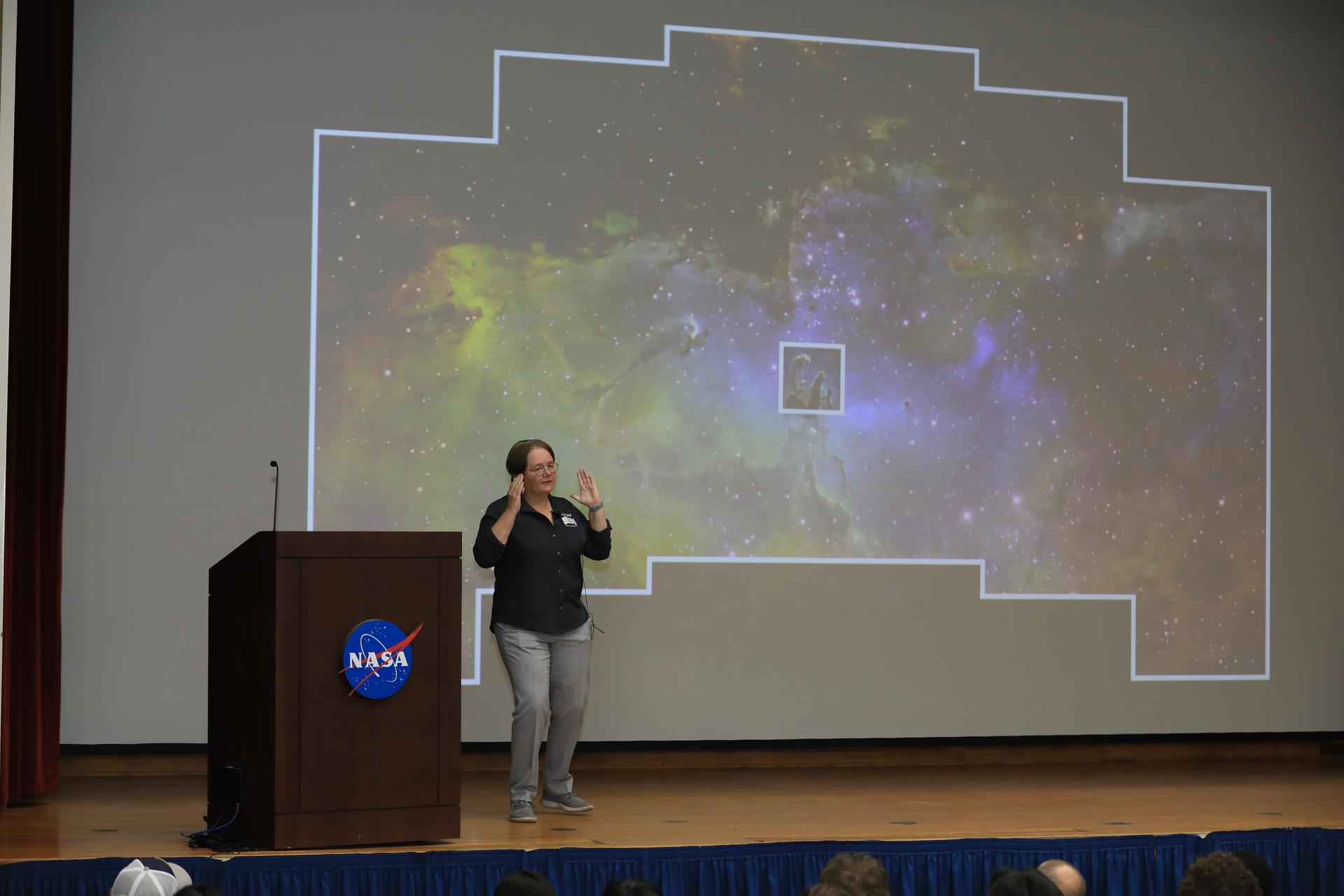 Dr. Julie McEnery, senior project scientist for NASA’s Nancy Grace Roman Space Telescope mission, discusses the upcoming Roman mission in the Training Auditorium at NASA’s Kennedy Space Center in Florida on Tuesday, July 21, 2026. McEnery is a leading astrophysicist at NASA's Goddard Space Flight Center in Greenbelt, Maryland, where she specializes in the study of high energy astrophysics and her work is expanding our understanding of the universe’s creation and behavior. Named for NASA’s first chief astronomer and “mother of the Hubble Space Telescope,” Roman will offer a field of view over 100 times larger than Hubble’s to study up to a billion galaxies, directly image exoplanets and planet forming disks, and address fundamental questions about dark energy, exoplanets, and infrared astrophysics.
