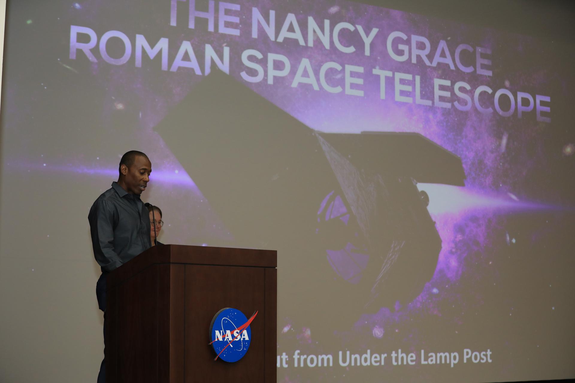 Denton Gibson, launch director of the Launch Services Program, introduces Dr. Julie McEnery, senior project scientist for NASA’s Nancy Grace Roman Space Telescope mission, in the Training Auditorium at NASA’s Kennedy Space Center in Florida on Tuesday, July 21, 2026. McEnery is a leading astrophysicist at NASA's Goddard Space Flight Center in Greenbelt, Maryland, where she specializes in the study of high energy astrophysics and her work is expanding our understanding of the universe’s creation and behavior. Named for NASA’s first chief astronomer and “mother of the Hubble Space Telescope,” Roman will offer a field of view over 100 times larger than Hubble’s to study up to a billion galaxies, directly image exoplanets and planet forming disks, and address fundamental questions about dark energy, exoplanets, and infrared astrophysics.
