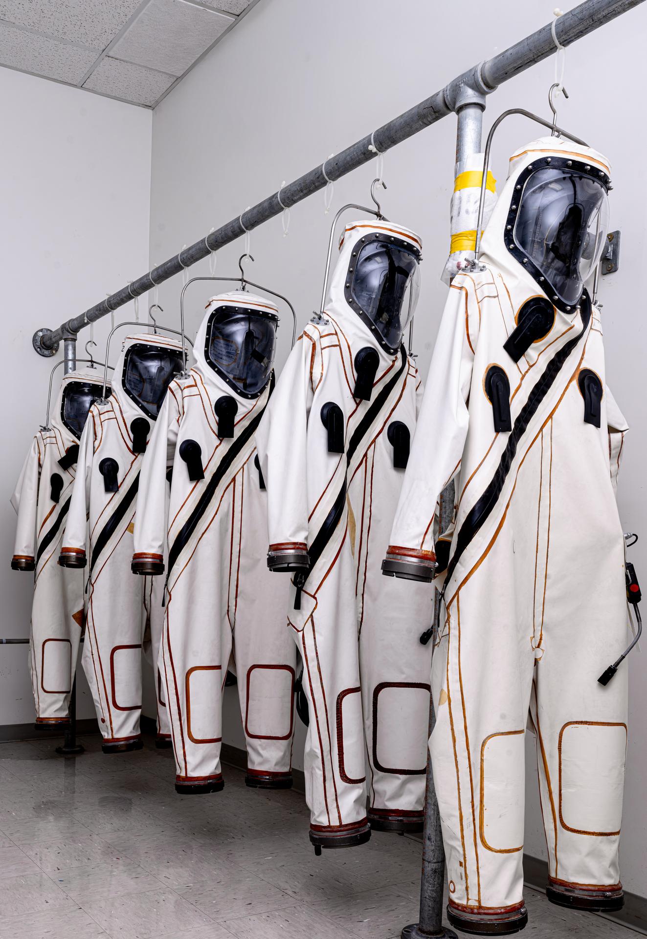 Self-Contained Atmospheric Protective Ensemble (SCAPE) suits hang on a rack the Multi Operations Support Building on Thursday, July 23, 2026, before technicians began operations to load propellant into NASA's Nancy Grace Roman Space Telescope. Once suited up technicians fueled Roman inside the Payload Hazardous Servicing Facility at NASA’s Kennedy Space Center in Florida with about 290 gallons (roughly 1,100 liters) of hydrazine. Roman’s primary mission is to settle essential questions about dark energy, exoplanets, and infrared astrophysics by conducting wide-field surveys that explore the universe’s structure, evolution, and composition. Liftoff atop a SpaceX Falcon Heavy rocket from NASA Kennedy’s Launch Complex 39A is targeted no earlier than Sunday, Aug. 30, 2026.