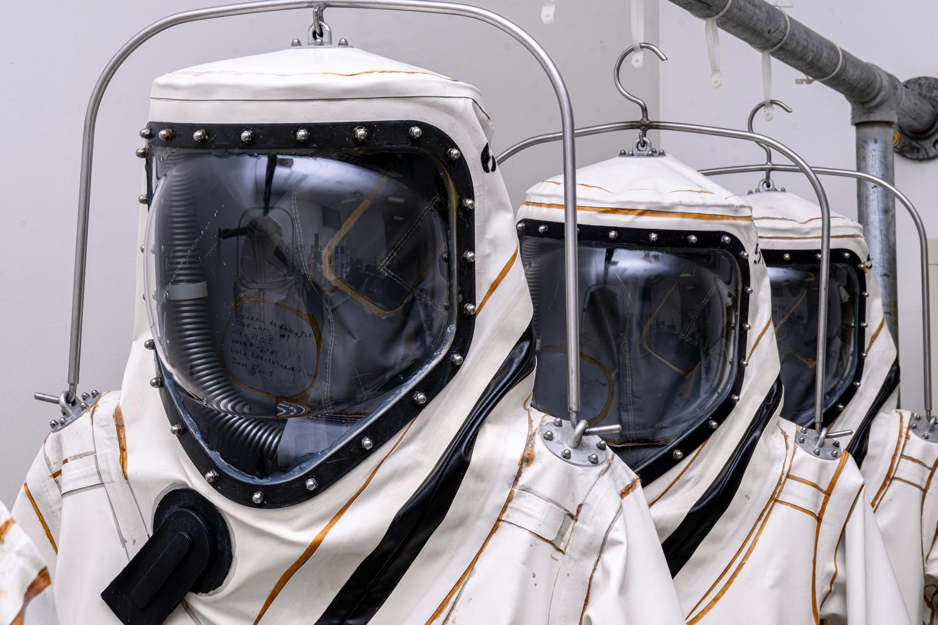 Self-Contained Atmospheric Protective Ensemble (SCAPE) suits hang on a rack the Multi Operations Support Building on Thursday, July 23, 2026, before technicians began operations to load propellant into NASA's Nancy Grace Roman Space Telescope. Once suited up technicians fueled Roman inside the Payload Hazardous Servicing Facility at NASA’s Kennedy Space Center in Florida with about 290 gallons (roughly 1,100 liters) of hydrazine. Roman’s primary mission is to settle essential questions about dark energy, exoplanets, and infrared astrophysics by conducting wide-field surveys that explore the universe’s structure, evolution, and composition. Liftoff atop a SpaceX Falcon Heavy rocket from NASA Kennedy’s Launch Complex 39A is targeted no earlier than Sunday, Aug. 30, 2026.