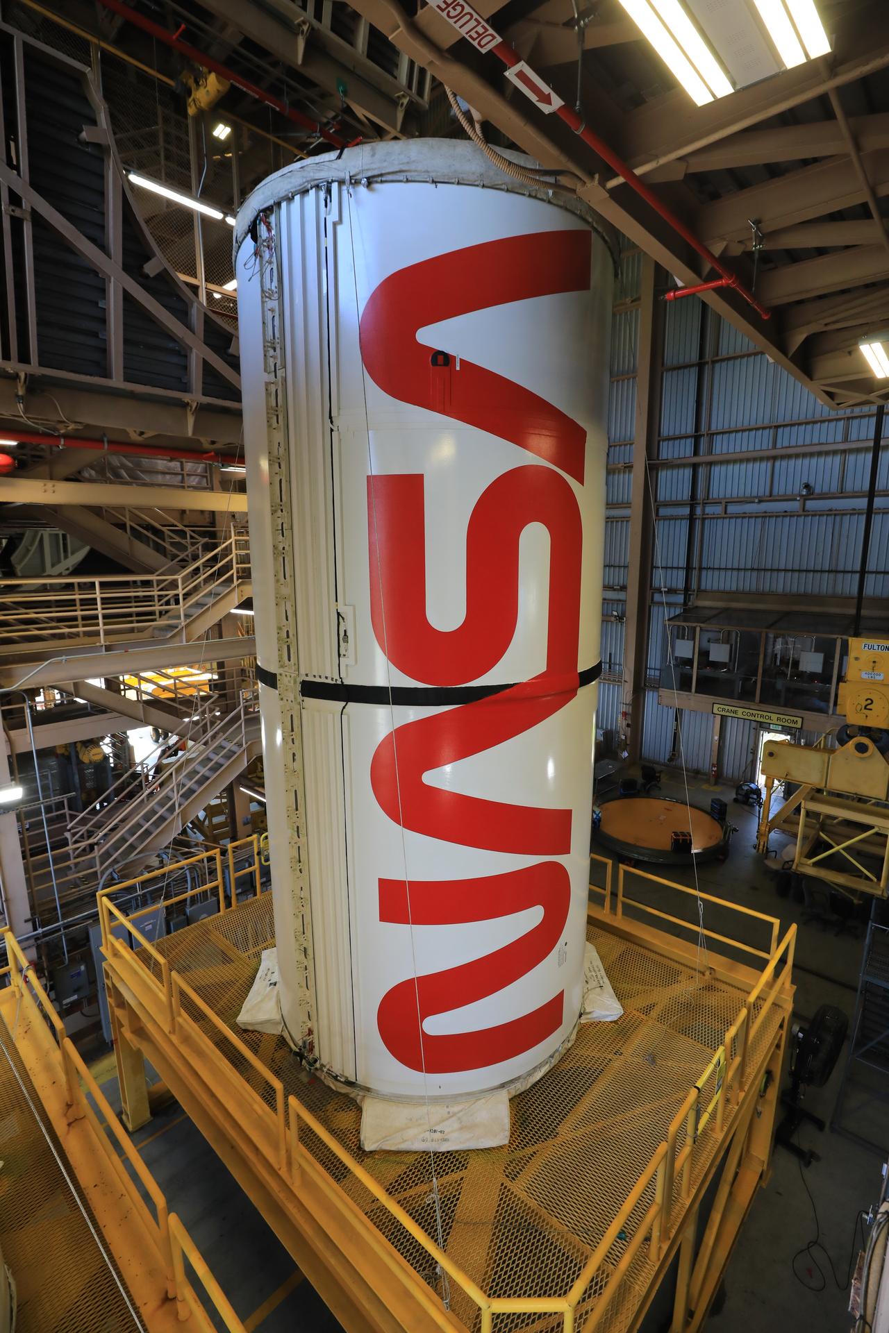 The right center center solid rocket booster segment, containing the NASA “worm” insignia, and the left center center solid rocket booster segment for the agency’s Artemis III SLS (Space Launch System) rocket undergo processing inside the Rotation, Processing and Surge Facility at the agency’s Kennedy Space Center in Florida on Friday, July 24, 2026. The SLS rocket’s twin boosters, manufactured by Northrop Grumman in Utah, will provide more than 75 percent of the SLS rocket’s total thrust at launch. The Artemis III mission will launch crew in the Orion spacecraft on top of the SLS rocket to test rendezvous and docking capabilities between Orion and commercial spacecraft needed to land astronauts on the Moon.