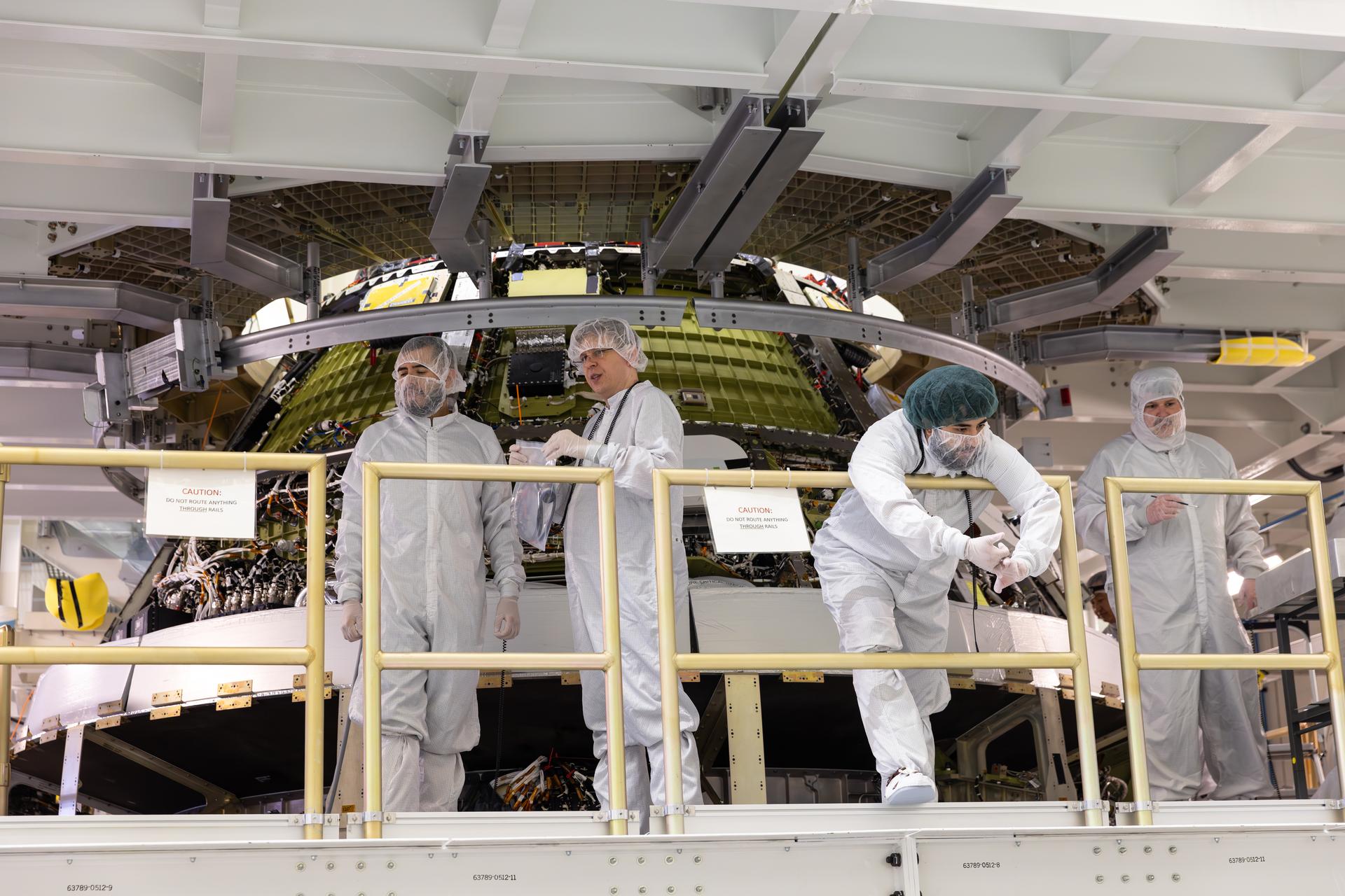 Engineers finish connecting the Artemis III Orion crew and service modules on Friday, July 31, 2026, inside the Neil A. Armstrong Operations and Checkout Building at NASA’s Kennedy Space Center in Florida. Now integrated, the team will power up the combined crew and service module for the first time then begin altitude chamber testing, which will put the spacecraft through conditions as close as possible to the environment it will experience in low Earth orbit. Artemis III and the four-person crew will carry out a series of objectives in low Earth orbit designed to demonstrate critical systems needed for future lunar landings, beginning with Artemis IV.
