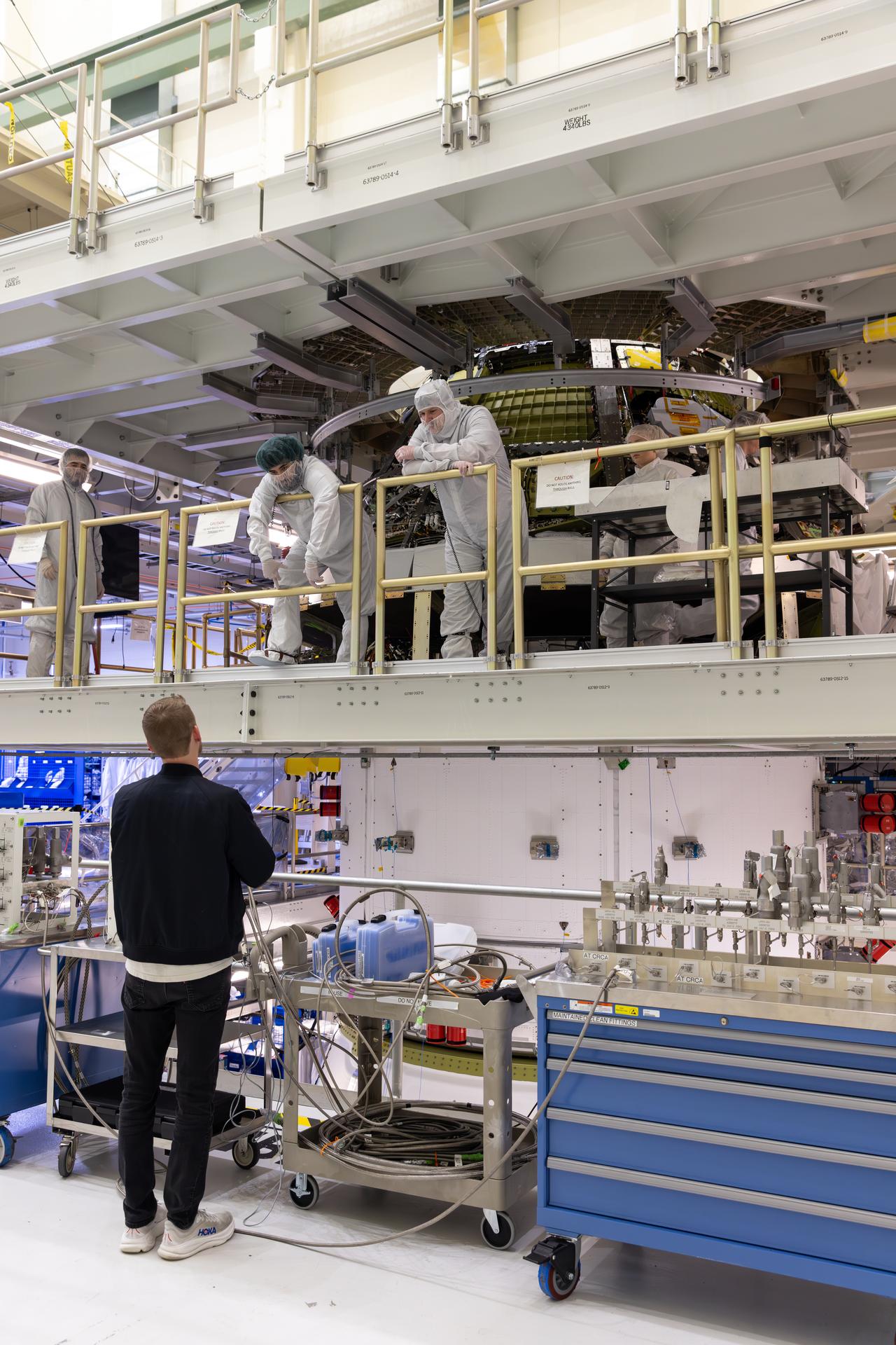 Engineers finish connecting the Artemis III Orion crew and service modules on Friday, July 31, 2026, inside the Neil A. Armstrong Operations and Checkout Building at NASA’s Kennedy Space Center in Florida. Now integrated, the team will power up the combined crew and service module for the first time then begin altitude chamber testing, which will put the spacecraft through conditions as close as possible to the environment it will experience in low Earth orbit. Artemis III and the four-person crew will carry out a series of objectives in low Earth orbit designed to demonstrate critical systems needed for future lunar landings, beginning with Artemis IV.