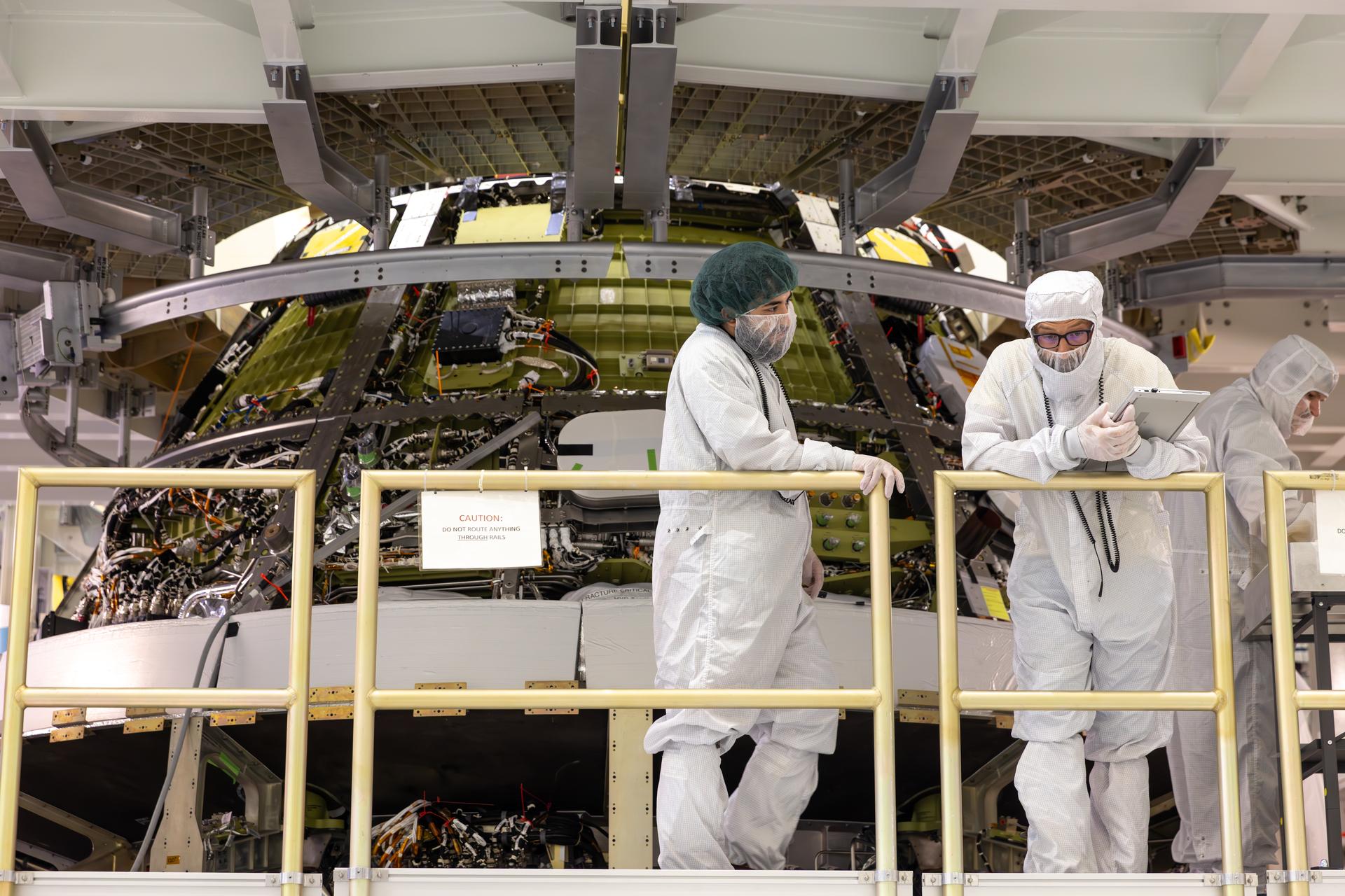 Engineers finish connecting the Artemis III Orion crew and service modules on Friday, July 31, 2026, inside the Neil A. Armstrong Operations and Checkout Building at NASA’s Kennedy Space Center in Florida. Now integrated, the team will power up the combined crew and service module for the first time then begin altitude chamber testing, which will put the spacecraft through conditions as close as possible to the environment it will experience in low Earth orbit. Artemis III and the four-person crew will carry out a series of objectives in low Earth orbit designed to demonstrate critical systems needed for future lunar landings, beginning with Artemis IV.