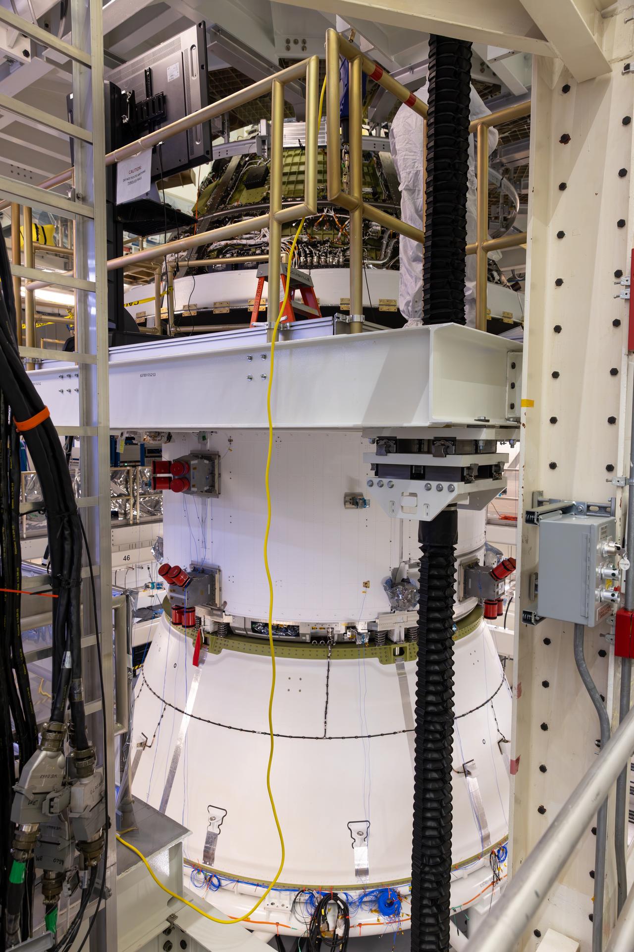Engineers finish connecting the Artemis III Orion crew and service modules on Friday, July 31, 2026, inside the Neil A. Armstrong Operations and Checkout Building at NASA’s Kennedy Space Center in Florida. Now integrated, the team will power up the combined crew and service module for the first time then begin altitude chamber testing, which will put the spacecraft through conditions as close as possible to the environment it will experience in low Earth orbit. Artemis III and the four-person crew will carry out a series of objectives in low Earth orbit designed to demonstrate critical systems needed for future lunar landings, beginning with Artemis IV.