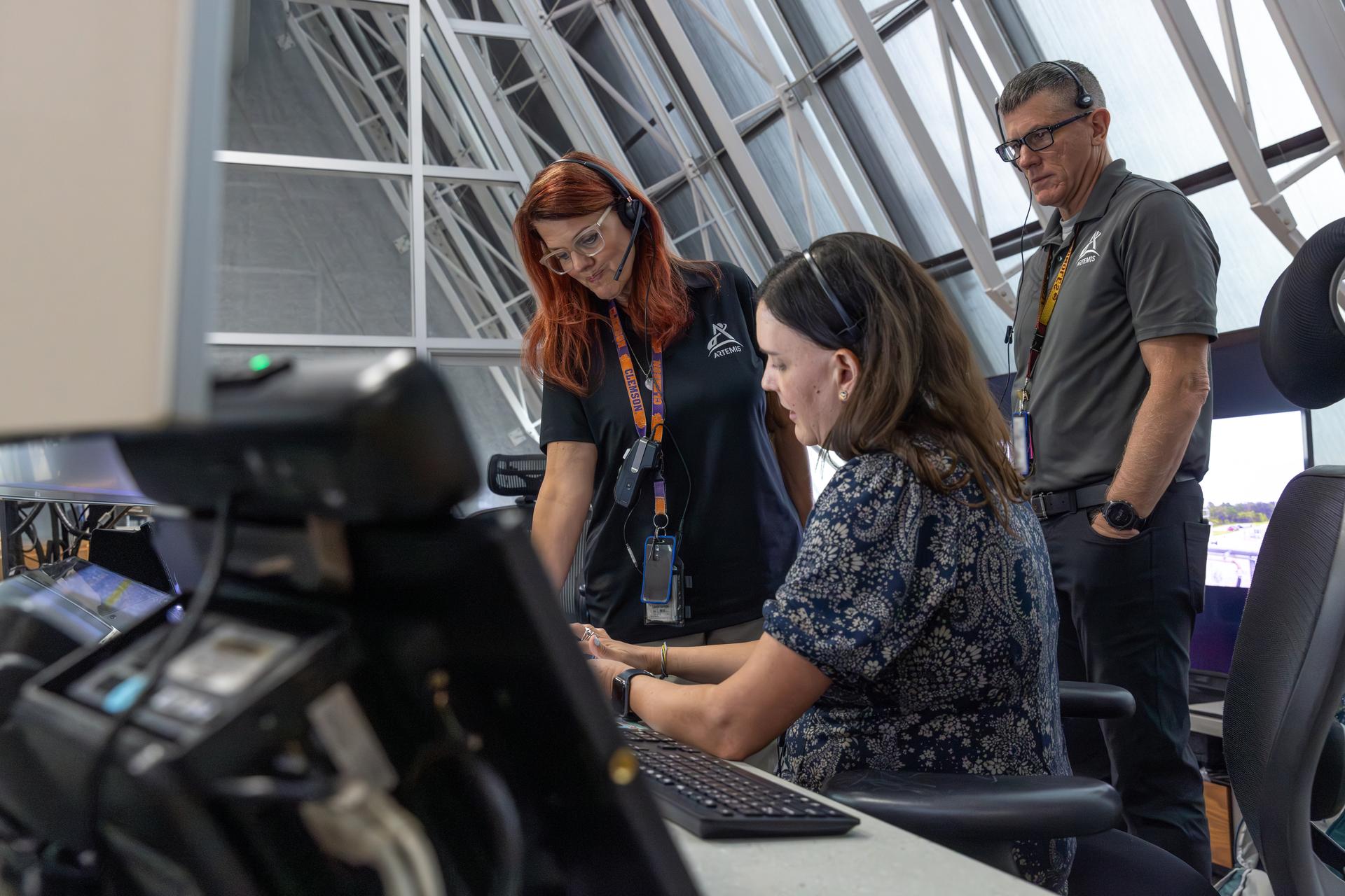 From left, Charlie Blackwell-Thompson, Artemis launch director; Mari Forrestel, Artemis launch director technical assistant; and Jeremy Graeber, assistant launch director, all with NASA’s Exploration Ground Systems Program, participate in a cryogenic propellant loading simulation for NASA’s Artemis III mission on Wednesday, Aug. 5, 2026, inside Firing Rooms 1 and 2 of the Rocco A. Petrone Launch Control Center at the agency’s Kennedy Space Center in Florida. Members of NASA’s Exploration Ground Systems team rehearse the steps to load the super-cooled liquid hydrogen and liquid oxygen into the SLS (Space Launch System) rocket core stage, a process that starts several hours before liftoff for the Artemis III mission. Artemis III will carry out a series of objectives in low Earth orbit designed to demonstrate critical systems needed for future lunar landings, beginning with Artemis IV.