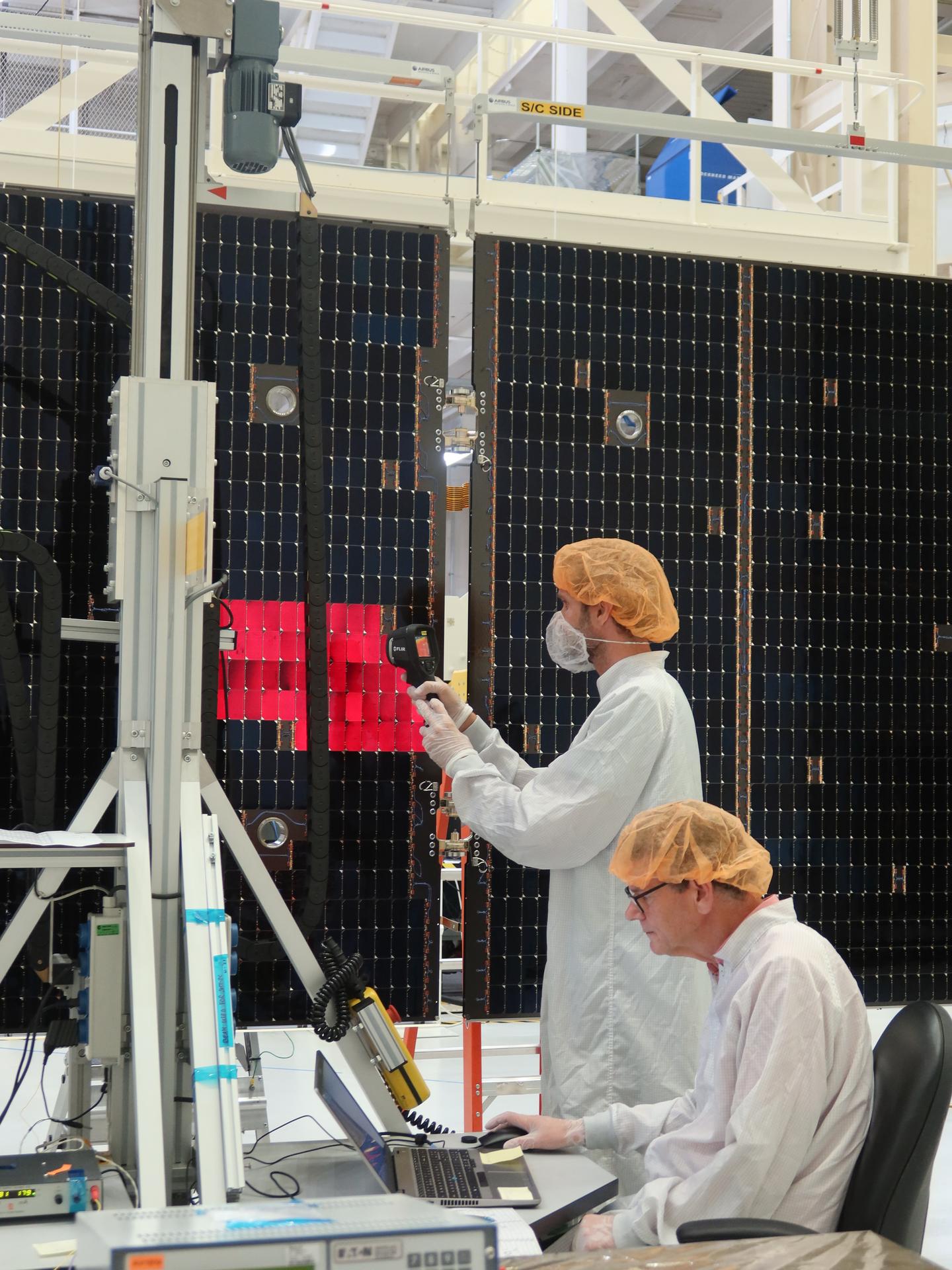 A technician is lighting one of the solar array wing panels as part of an illumination test for Artemis III inside the Neil A. Armstrong Operations and Checkout Building high bay at NASA’s Kennedy Space Center in Florida on Tuesday, Aug. 18, 2026. Technicians extended, inspected, and then retracted the four wings that will be attached to the Orion service module. Each solar array panel, provided by the European Space Agency and built by Airbus, generates 11 kilowatts of power and spans about 63 feet to supply Orion’s power, propulsion, air, and water through low Earth Orbit.