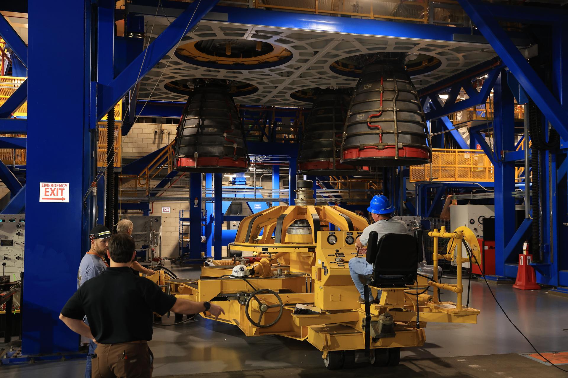 Technicians install three of four RS-25 SLS (Space Launch System) rocket engines on the work stand for integration with the Artemis III core stage rocket on Friday, Aug. 28, 2026, inside the Vehicle Assembly Building at NASA’s Kennedy Space Center in Florida. During Artemis III, the four RS-25 engines will launch the Orion spacecraft and its crew of four into low Earth orbit, generating more than two million pounds of thrust at liftoff.