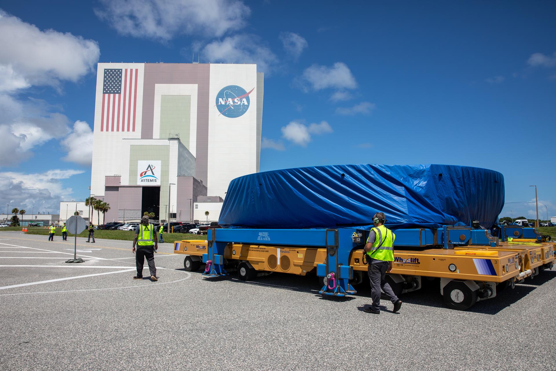 Teams from NASA’s Kennedy Space Center in Florida transport the agency’s Artemis IV SLS (Space Launch System) core stage boat-tail from NASA’s Pegasus barge to inside the NASA’s Vehicle Assembly Building at Kennedy Space Center in Florida on Monday, Aug. 31, 2026. Manufactured at NASA’s Michoud Assembly Facility in New Orleans, Louisiana, the boat-tail is a fairing-like structure that protects the bottom end of the SLS (Space Launch System) rocket core stage and RS-25 engines.