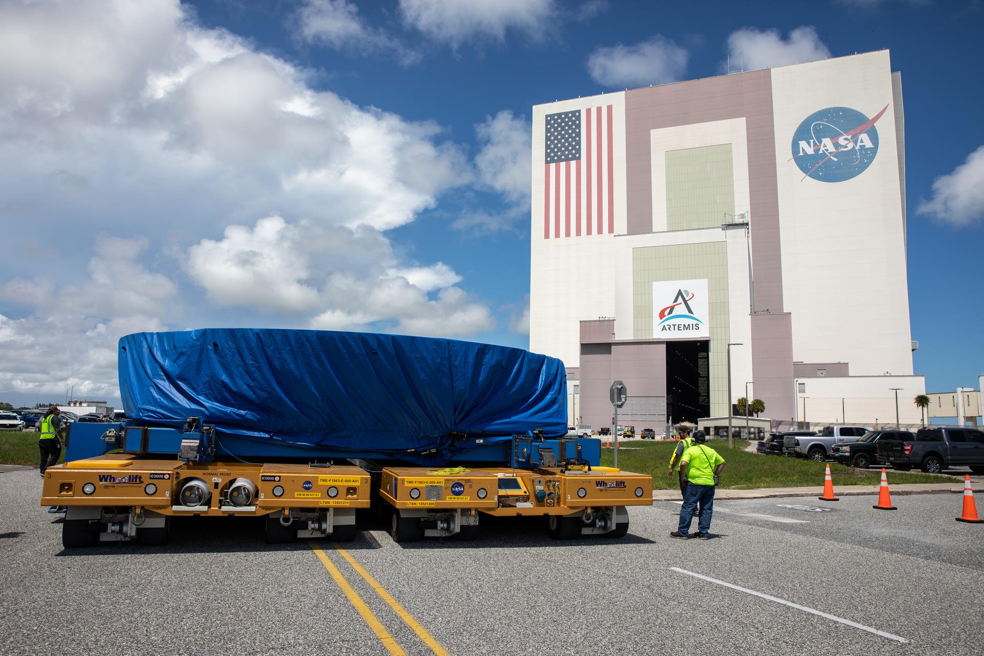 Teams from NASA’s Kennedy Space Center in Florida transport the agency’s Artemis IV SLS (Space Launch System) core stage boat-tail from NASA’s Pegasus barge to inside the NASA’s Vehicle Assembly Building at Kennedy Space Center in Florida on Monday, Aug. 31, 2026. Manufactured at NASA’s Michoud Assembly Facility in New Orleans, Louisiana, the boat-tail is a fairing-like structure that protects the bottom end of the SLS (Space Launch System) rocket core stage and RS-25 engines.