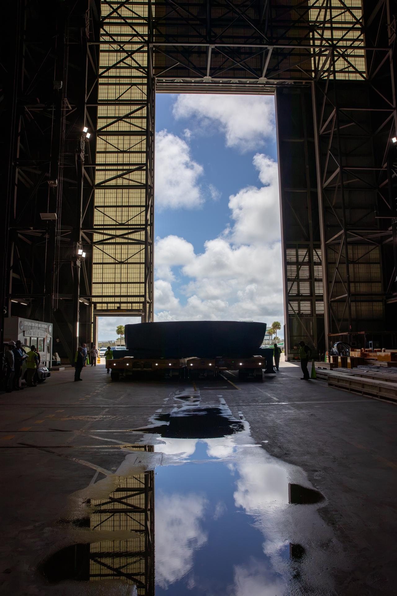 NASA’s Artemis IV SLS (Space Launch System) core stage boat-tail, covered in a protective blue tarp, arrives inside the NASA’s Vehicle Assembly Building at Kennedy Space Center in Florida on Monday, Aug. 31, 2026. Manufactured at NASA’s Michoud Assembly Facility in New Orleans, Louisiana, the boat-tail is a fairing-like structure that protects the bottom end of the SLS (Space Launch System) rocket core stage and RS-25 engines.   