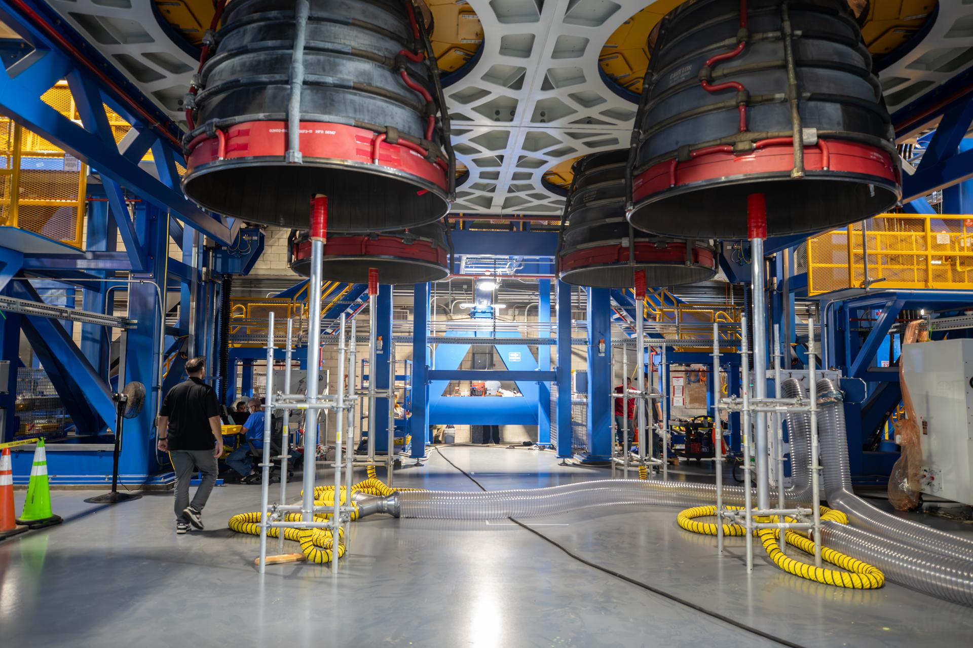 Technicians complete installation of all four RS-25 SLS (Space Launch System) rocket engines on the work stand for integration with the Artemis III core stage rocket on Tuesday, Sept. 1, 2026, inside the Vehicle Assembly Building at NASA’s Kennedy Space Center in Florida. During Artemis III, the four RS-25 engines will launch SLS, the Orion spacecraft and its crew of four into low Earth orbit, generating more than two million pounds of thrust at liftoff.