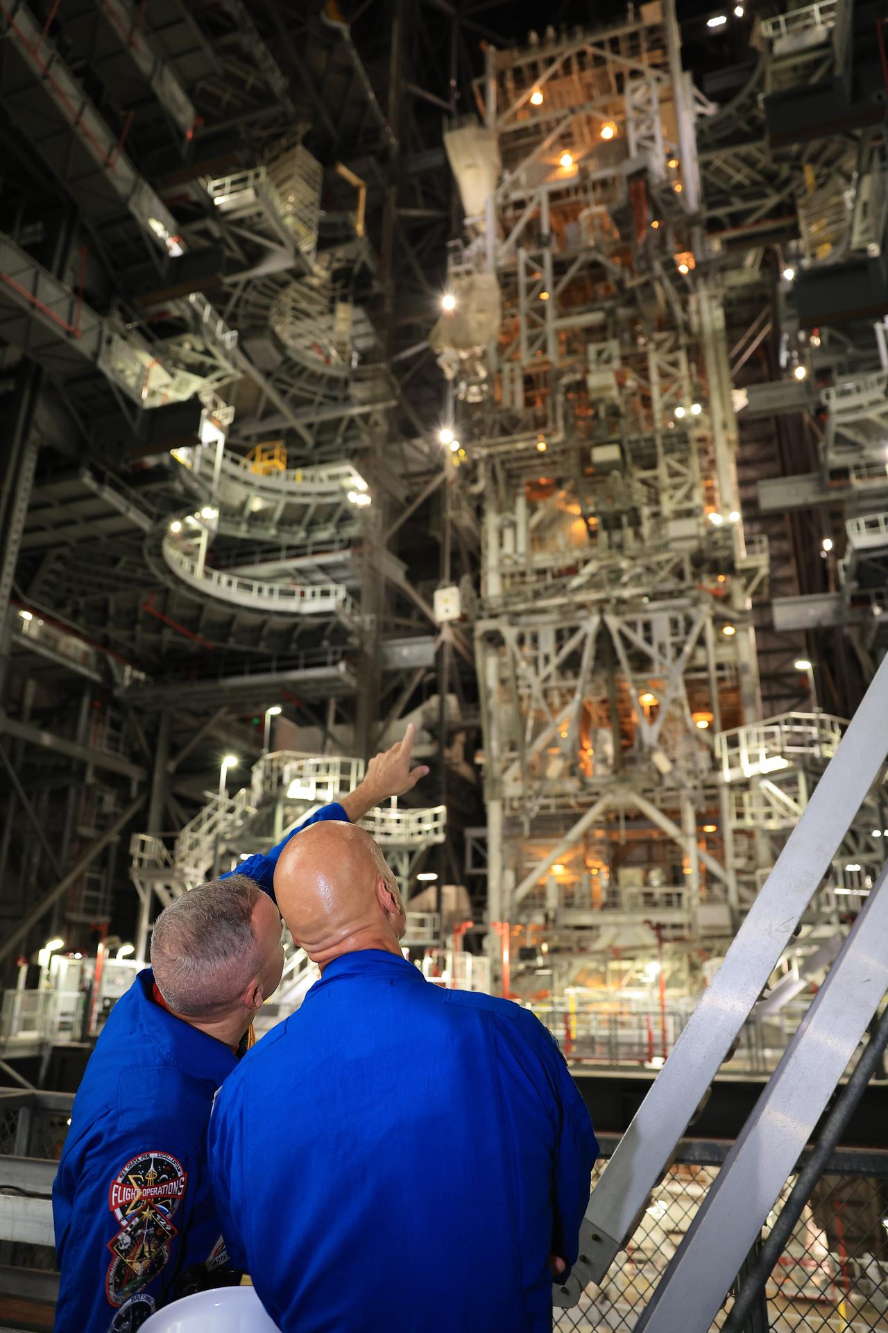 NASA astronaut Randy Bresnik (left) and ESA (European Space Agency) astronaut Luca Parmitano view progress on the solid rocket booster integration in High Bay 3 inside the Vehicle Assembly Building at NASA's Kennedy Space Center in Florida on Wednesday, Sept. 2, 2026. Bresnik, Parmitano, as well as NASA astronauts Andre Douglas, Frank Rubio, and Bob Hines made the first visit to Kennedy by the entire crew and backup crew members of Artemis III. The mission will launch four crew members aboard the Orion spacecraft to carry out a series of objectives in low Earth orbit designed to demonstrate critical systems needed for future lunar landings, beginning with Artemis IV.
