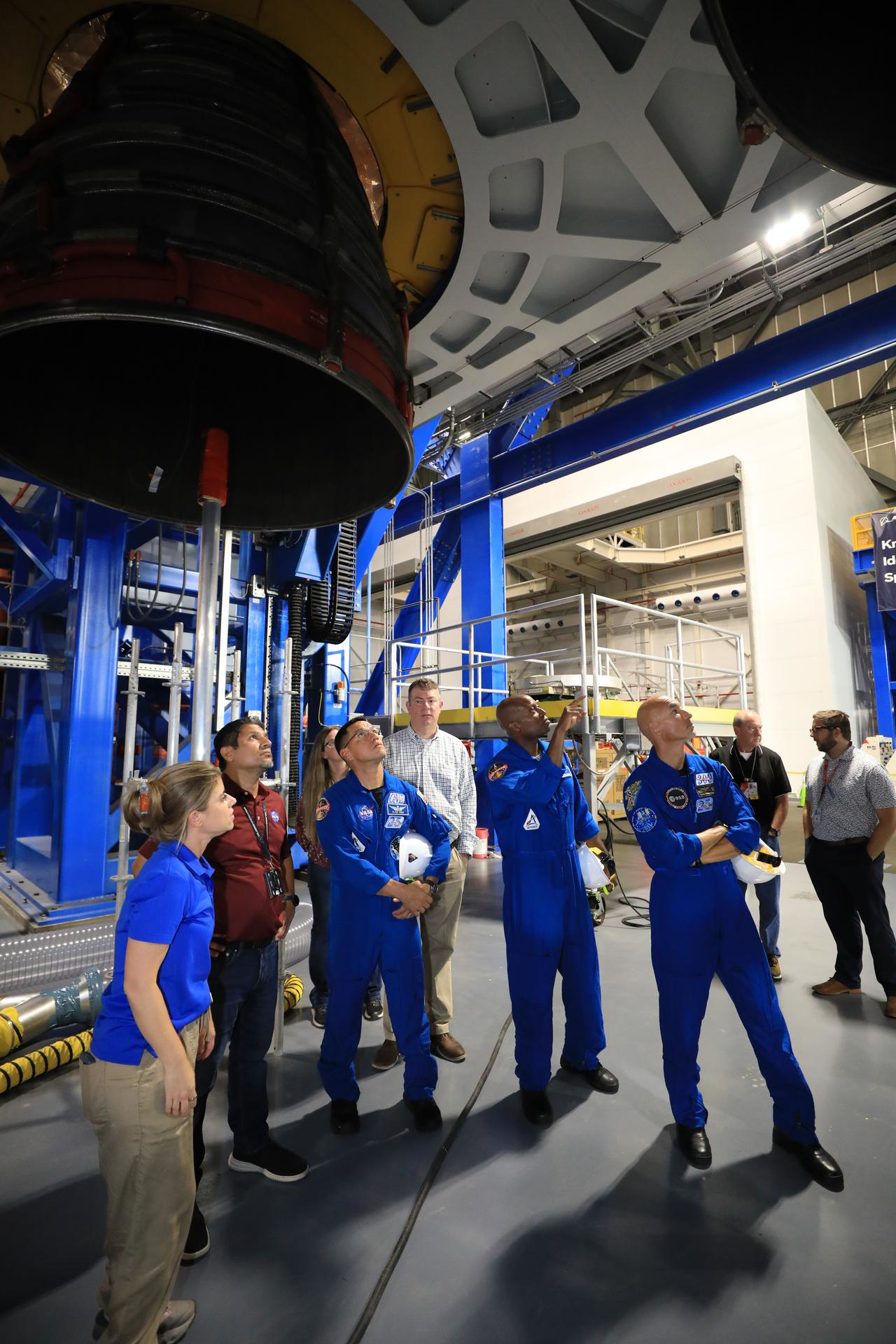 The Artemis III primary and back-up crew members view the work progress on the Artemis III SLS (Space Launch System) rocket core stage inside High Bay 2 of the Vehicle Assembly Building at NASA's Kennedy Space Center in Florida on Wednesday, Sept. 2, 2026. Dressed in blue flight suits, NASA astronauts Frank Rubio and Andre Douglas, as well as ESA (European Space Agency) astronaut Luca Parmitano view the four RS-25 engines on the work stand for integration with the core stage. This marked the first visit to Kennedy by the entire crew and backup crew members. Artemis III will launch four crew members aboard the Orion spacecraft to carry out a series of objectives in low Earth orbit designed to demonstrate critical systems needed for future lunar landings, beginning with Artemis IV.