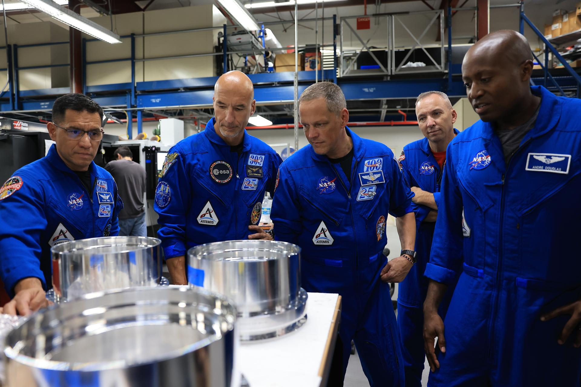 From left, NASA astronaut Frank Rubio, ESA (European Space Agency) astronaut Luca Parmitano, and NASA astronauts Bob Hines, Randy Bresnik, and Andre Douglas visit the Prototype Development Laboratory at NASA's Kennedy Space Center in Florida on Wednesday, Sept. 2, 2026. The Artemis III primary and back-up crew members visited multiple facilities at Kennedy and viewed the work progress on Artemis III hardware, marking their first joint visit to the spaceport. Artemis III will launch four crew members aboard the Orion spacecraft to carry out a series of objectives in low Earth orbit designed to demonstrate critical systems needed for future lunar landings, beginning with Artemis IV.