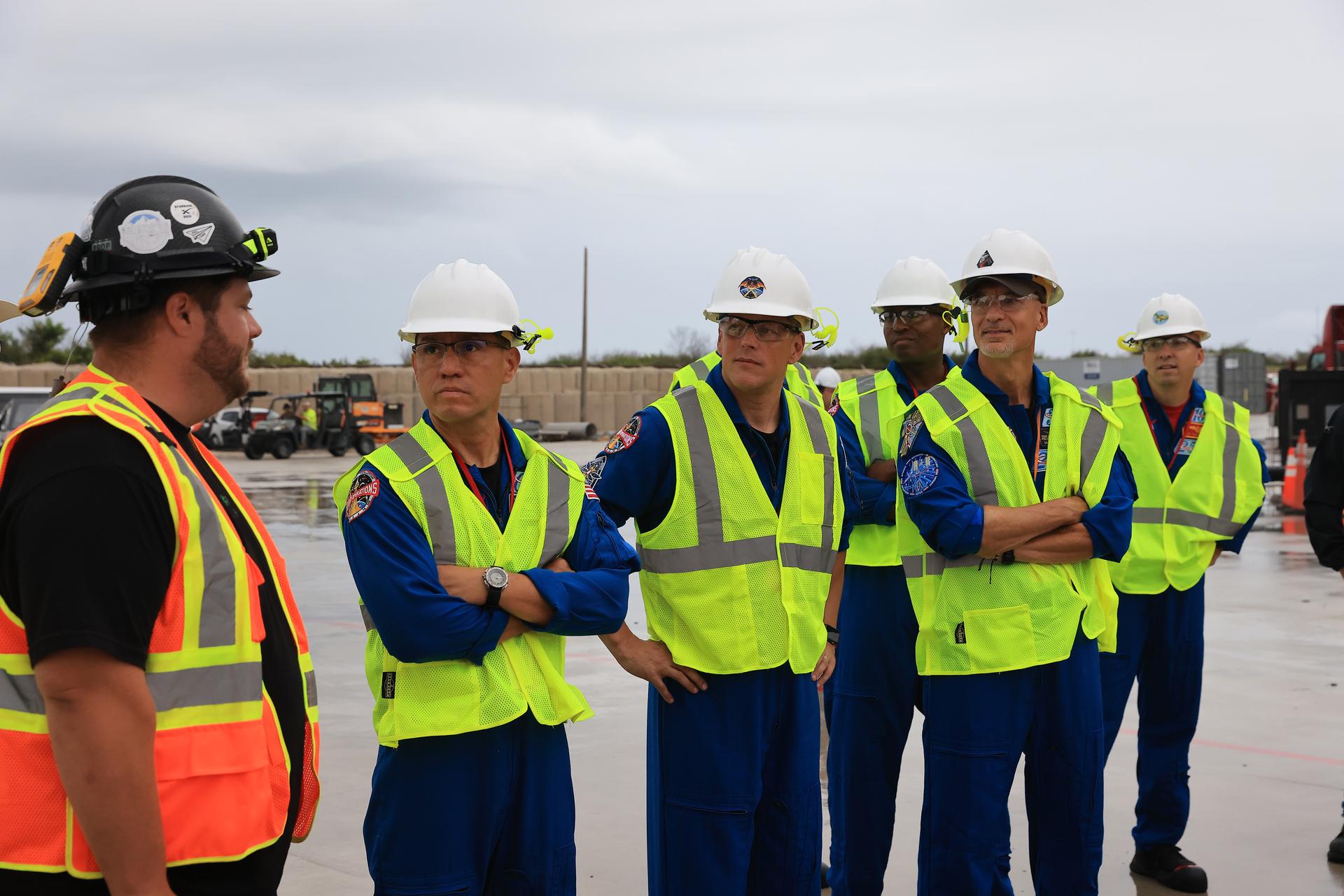 NASA’s Artemis III crew visits Launch Complex 39A at Kennedy Space Center in Florida on Thursday, Sept. 3, 2026, and speaks with members of SpaceX’s pad support team. Wearing hard hats and reflective vests over their blue flight suits, from left, NASA astronauts Frank Rubio, Bob Hines, Andre Douglas, ESA (European Space Agency) astronaut Luca Parmitano, and NASA astronaut Randy Bresnik visited facilities around Kennedy and viewed progress on Artemis III hardware and ground systems. This marked the first visit to Kennedy by the entire crew and backup crew members. Artemis III will launch four crew members aboard the Orion spacecraft to carry out a series of objectives in low Earth orbit designed to demonstrate critical systems needed for future lunar landings, beginning with Artemis IV.