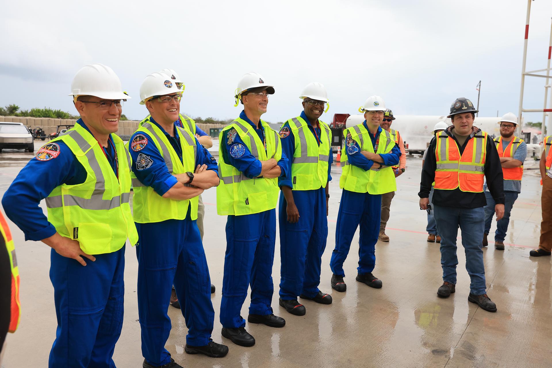 NASA’s Artemis III crew visits Launch Complex 39A at Kennedy Space Center in Florida on Thursday, Sept. 3, 2026, and speaks with members of SpaceX’s pad support team. Wearing hard hats and reflective vests over their blue flight suits, from left, NASA astronauts Frank Rubio, Bob Hines, Andre Douglas, ESA (European Space Agency) astronaut Luca Parmitano, and NASA astronaut Randy Bresnik visited facilities around Kennedy and viewed progress on Artemis III hardware and ground systems. This marked the first visit to Kennedy by the entire crew and backup crew members. Artemis III will launch four crew members aboard the Orion spacecraft to carry out a series of objectives in low Earth orbit designed to demonstrate critical systems needed for future lunar landings, beginning with Artemis IV.
