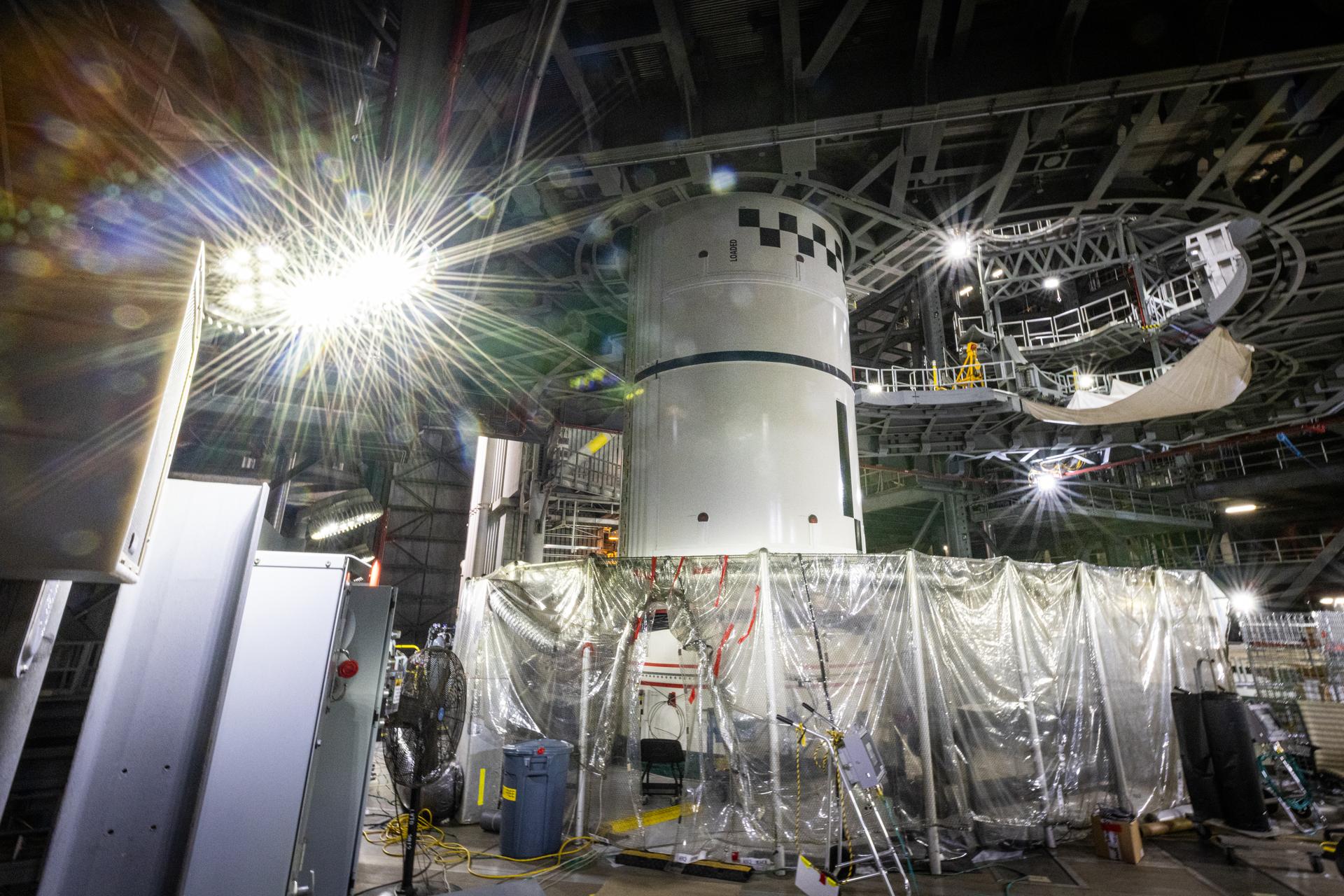 Technicians integrate the left forward booster segment for NASA’s Artemis III SLS (Space Launch System) rocket onto the left booster segments atop the mobile launcher in High Bay 3 of the Vehicle Assembly Building at NASA’s Kennedy Space Center in Florida on Thursday, Sept. 17, 2026. The SLS rocket’s twin boosters, each made up of five segments manufactured by Northrop Grumman in Utah, will provide more than 75 percent of the rocket’s total thrust at launch. The Artemis III mission will launch crew in the Orion spacecraft on top of the SLS rocket to test rendezvous and docking capabilities between Orion and commercial spacecraft needed to land astronauts on the Moon.