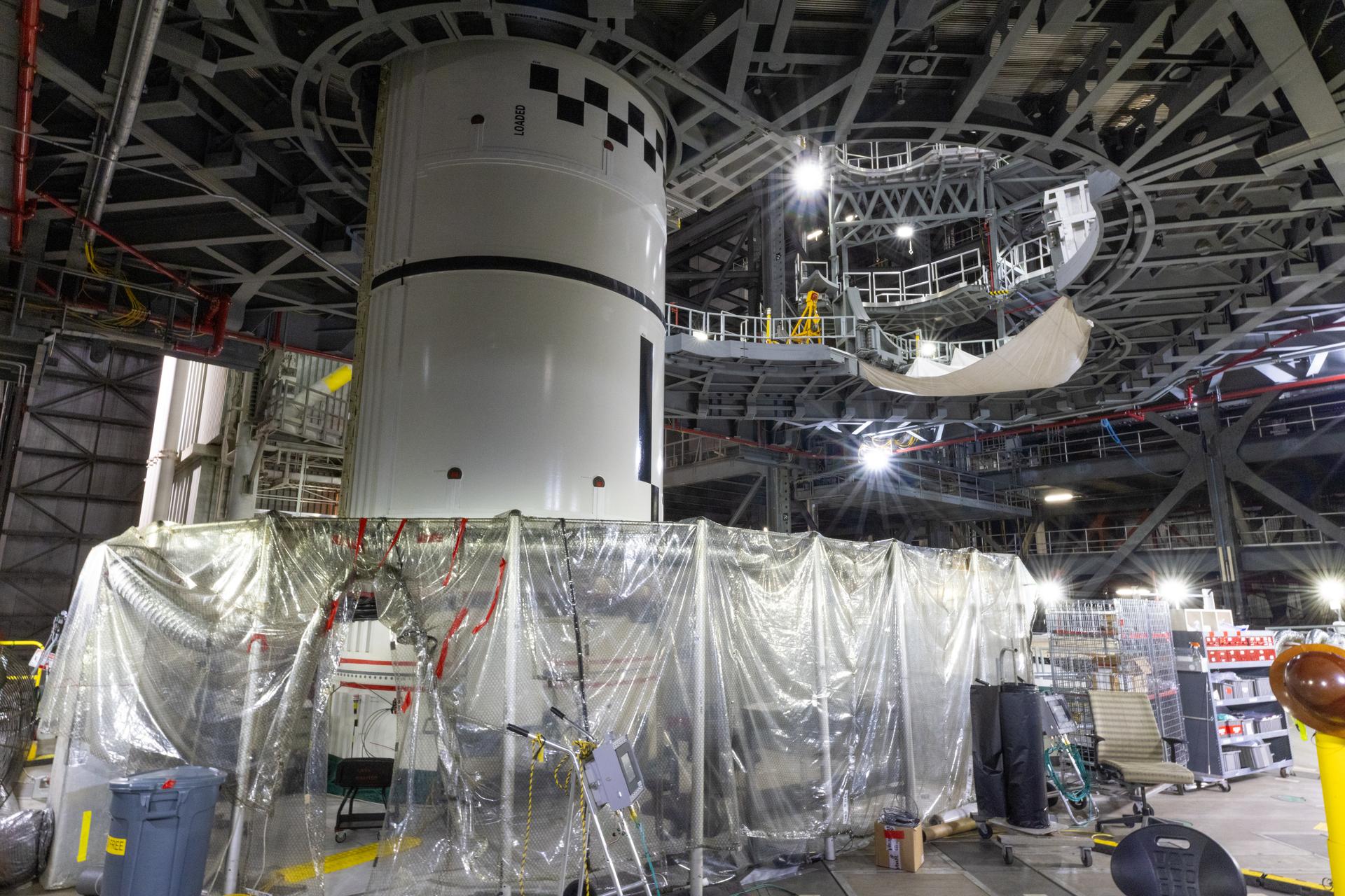 Technicians integrate the left forward booster segment for NASA’s Artemis III SLS (Space Launch System) rocket onto the left booster segments atop the mobile launcher in High Bay 3 of the Vehicle Assembly Building at NASA’s Kennedy Space Center in Florida on Thursday, Sept. 17, 2026. The SLS rocket’s twin boosters, each made up of five segments manufactured by Northrop Grumman in Utah, will provide more than 75 percent of the rocket’s total thrust at launch. The Artemis III mission will launch crew in the Orion spacecraft on top of the SLS rocket to test rendezvous and docking capabilities between Orion and commercial spacecraft needed to land astronauts on the Moon.