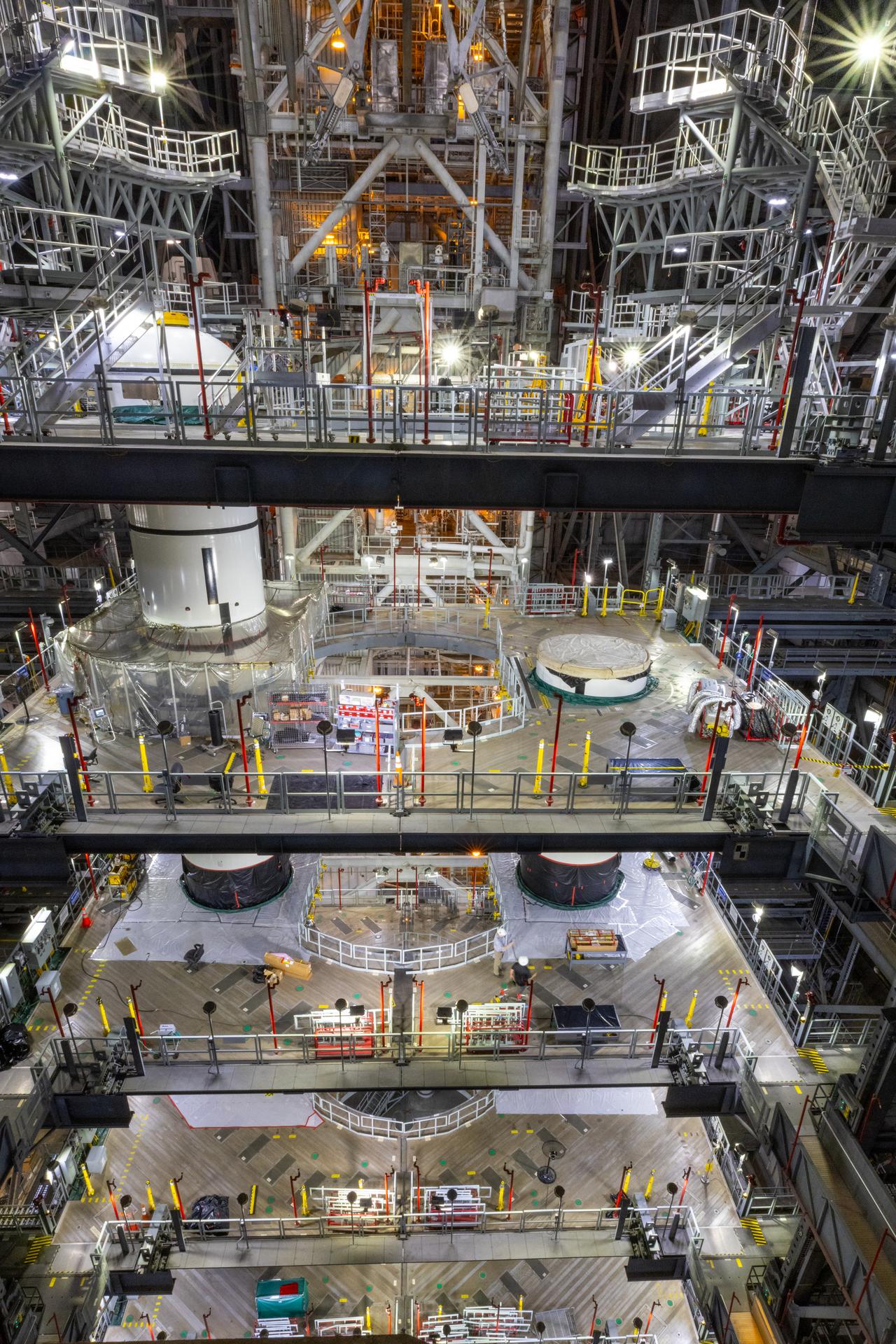 Technicians integrate the left forward booster segment for NASA’s Artemis III SLS (Space Launch System) rocket onto the left booster segments atop the mobile launcher in High Bay 3 of the Vehicle Assembly Building at NASA’s Kennedy Space Center in Florida on Thursday, Sept. 17, 2026. The SLS rocket’s twin boosters, each made up of five segments manufactured by Northrop Grumman in Utah, will provide more than 75 percent of the rocket’s total thrust at launch. The Artemis III mission will launch crew in the Orion spacecraft on top of the SLS rocket to test rendezvous and docking capabilities between Orion and commercial spacecraft needed to land astronauts on the Moon.