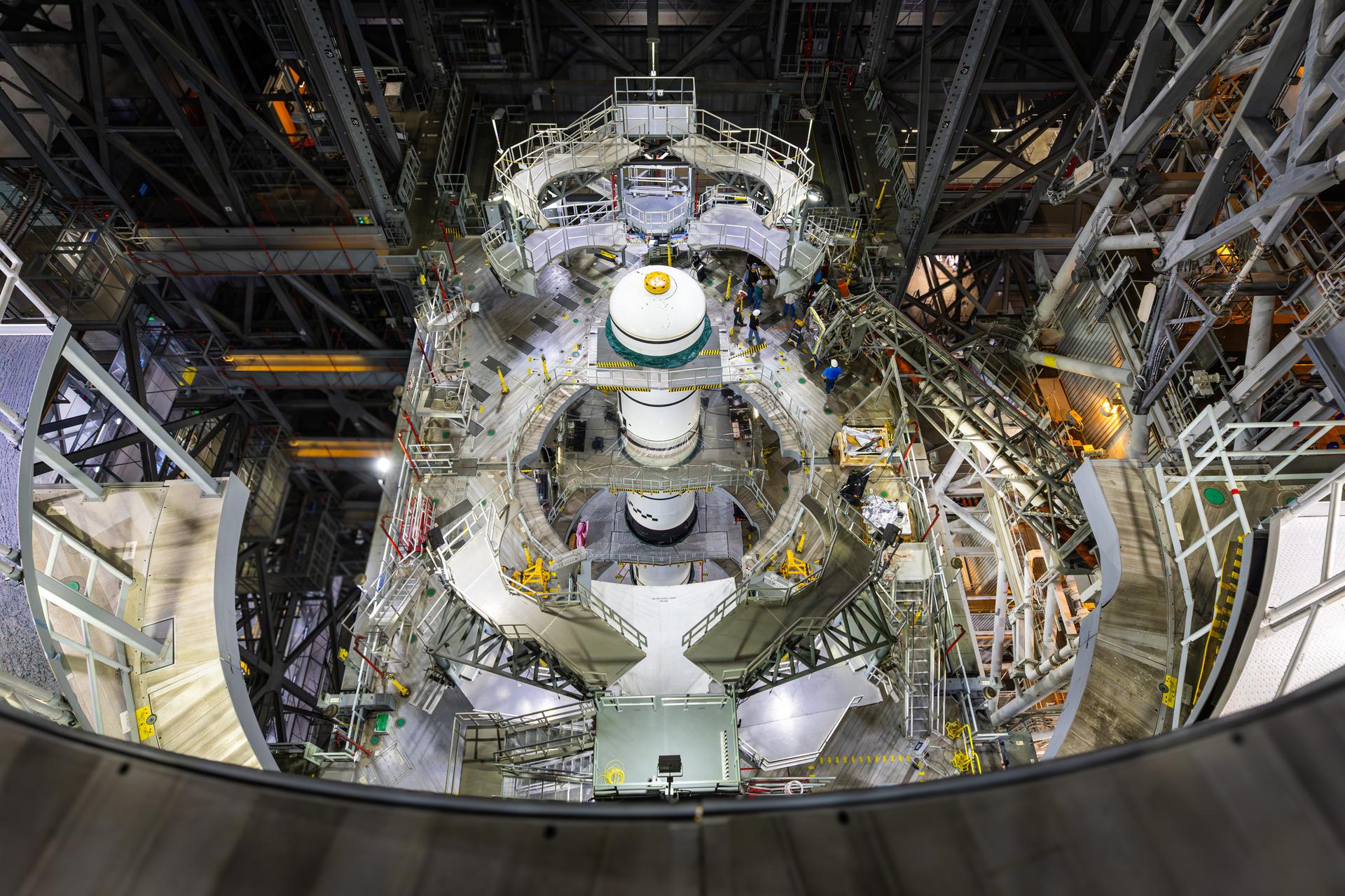 Technicians integrate the left forward booster segment for NASA’s Artemis III SLS (Space Launch System) rocket onto the left booster segments atop the mobile launcher in High Bay 3 of the Vehicle Assembly Building at NASA’s Kennedy Space Center in Florida on Thursday, Sept. 17, 2026. The SLS rocket’s twin boosters, each made up of five segments manufactured by Northrop Grumman in Utah, will provide more than 75 percent of the rocket’s total thrust at launch. The Artemis III mission will launch crew in the Orion spacecraft on top of the SLS rocket to test rendezvous and docking capabilities between Orion and commercial spacecraft needed to land astronauts on the Moon.