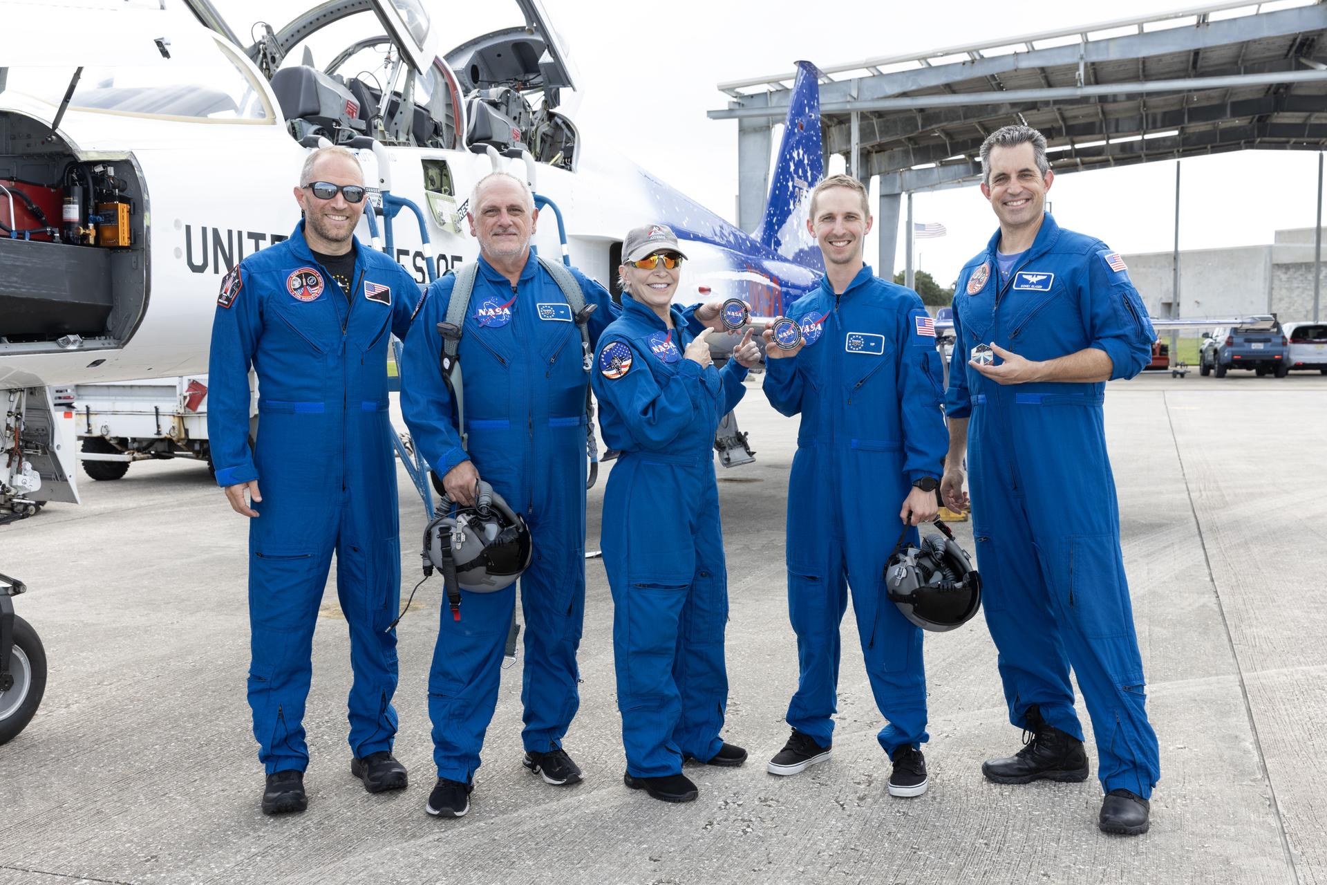From left, pilot Doug "Tut" Demko, NASA employees Gary O’Neil, Tammy Fenk, Alec Jacobs, and pilot Scott "Gomex" Glaser participate in an employee incentive flying event using NASA Administrator Jared Isaacman's personal F-5 aircraft, Thursday, Sept. 17, 2026, at NASA’s Kennedy Space Center in Florida. As part of the agency’s Flight Experience Award program, the employees donned NASA flight suits, completed preflight briefings, and experienced a unique flight. The ride-along flight experience award program highlights NASA’s commitment to celebrating excellence across the workforce.