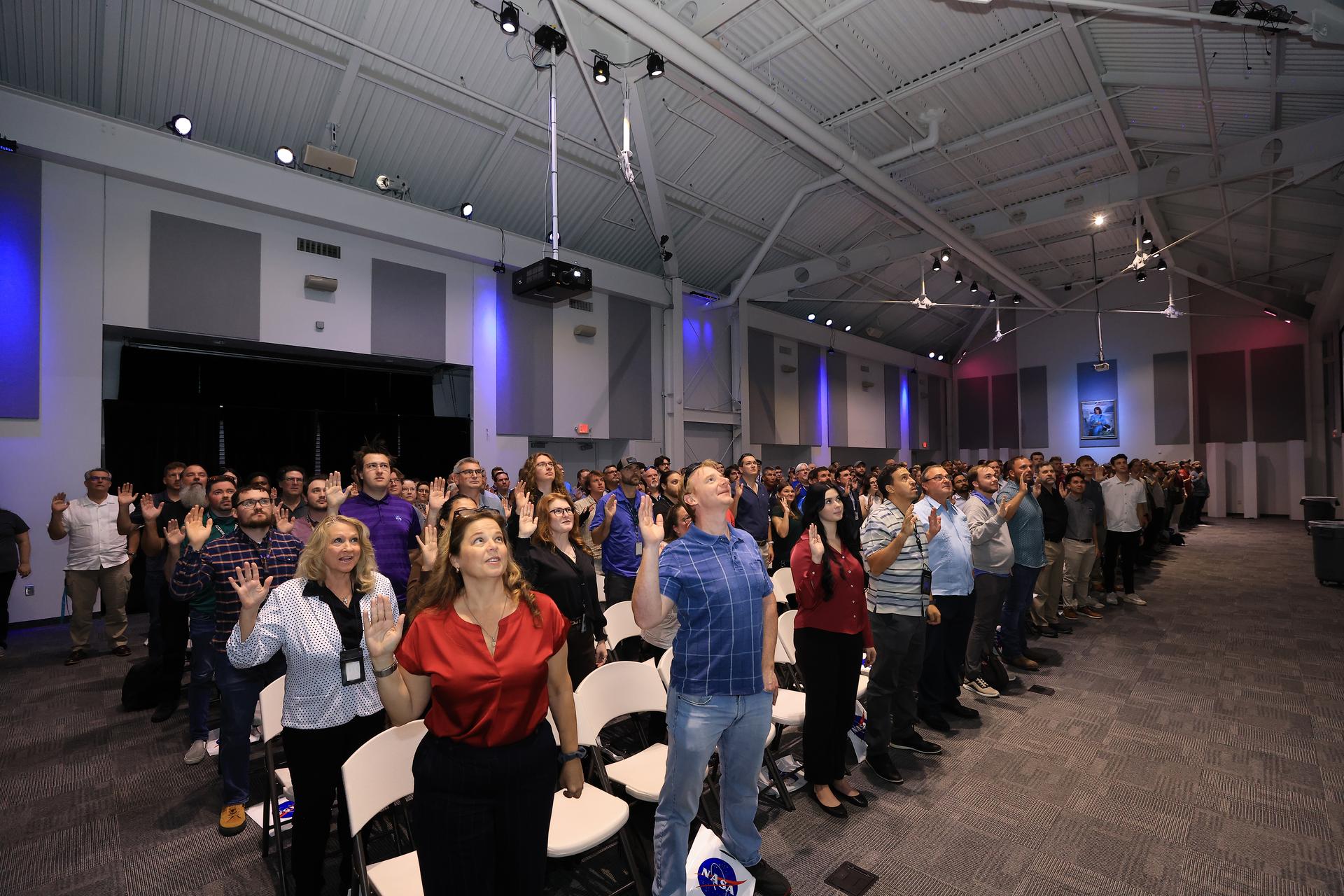 NASA’s newest civil servants participate in a swearing-in ceremony on Monday, Sept. 21, 2026, inside the Astronauts Memorial Foundation’s Center for Space Education at the Kennedy Space Center Visitor Complex in Florida. The ceremony featured the swearing-in of employees formerly from the Consolidated Operations, Management, Engineering, and Test (COMET) contract, as well as outside hires, as part of the administrator’s workforce directive to restore technical core competencies within the civil servants ranks.