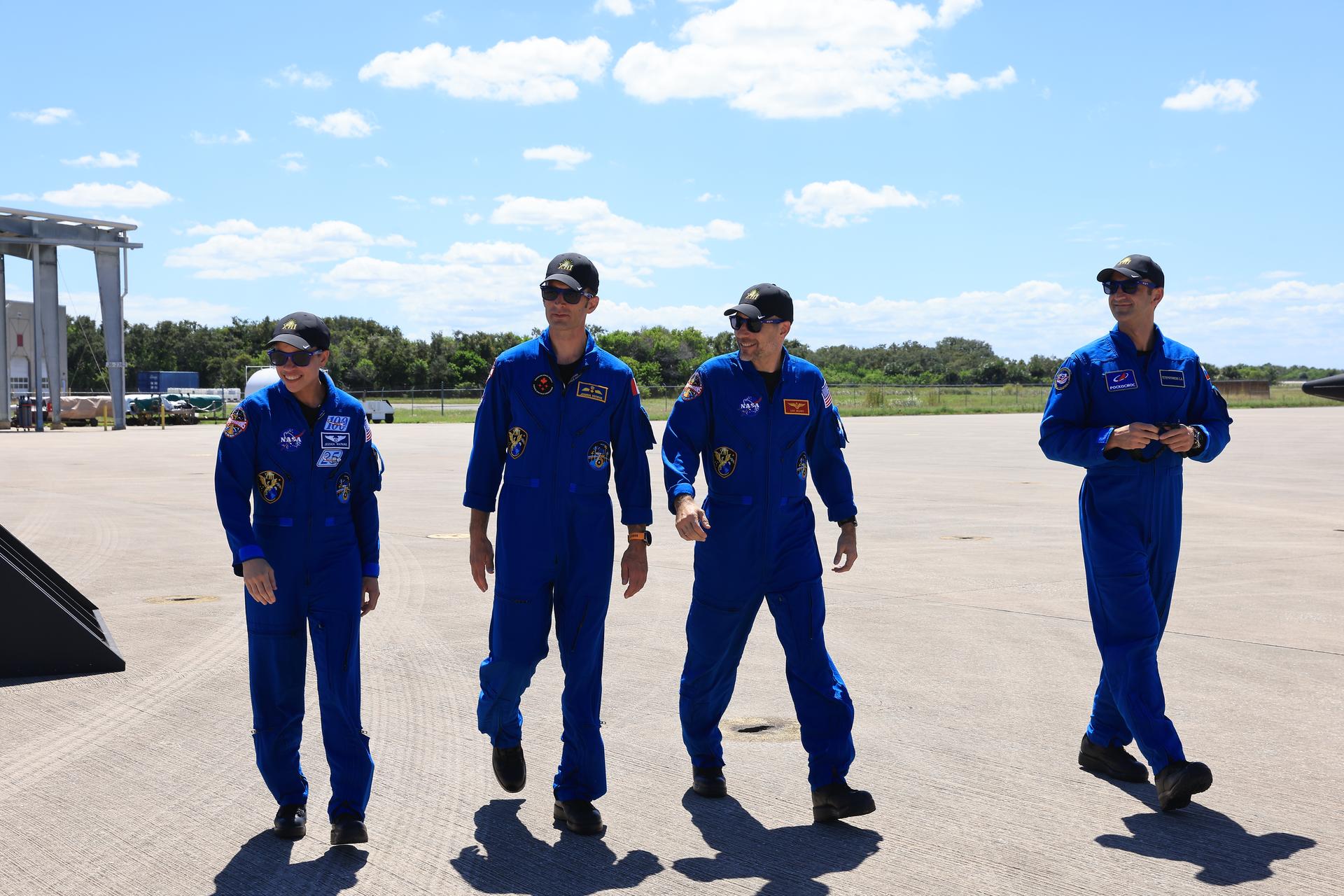 From left, crew members of NASA’s SpaceX Crew-13 mission, NASA astronaut Jessica Watkins, CSA (Canadian Space Agency) astronaut Joshua Kutryk, NASA astronaut Luke Delaney, and Roscosmos cosmonaut Sergey Teteryatnikov arrive Saturday, Sept. 26, 2026, at the Shuttle Landing Facility at the agency’s Kennedy Space Center in Florida. The Crew-13 mission is slated to launch to the International Space Station aboard SpaceX’s Dragon spacecraft atop company’s Falcon 9 rocket from Cape Canaveral Space Force Station’s Space Launch Complex 40 at 11:10 a.m. EDT on Thursday, Oct. 1. 