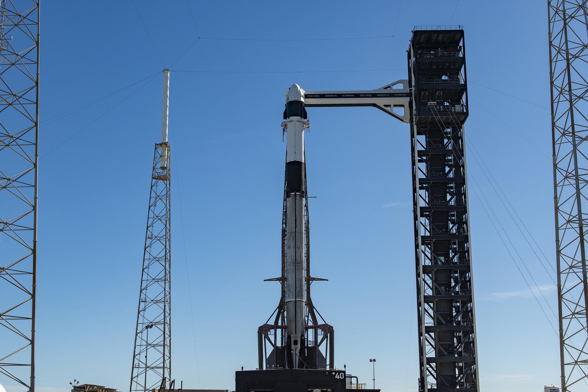 Ahead of launch of NASA’s SpaceX Crew-13 mission, a SpaceX Falcon 9 rocket, with the Dragon spacecraft atop, is vertical at the launch pad of Space Launch Complex 40 at Cape Canaveral Space Force Station in Florida on Sunday, Sept. 27, 2026. NASA astronauts Jessica Watkins and Luke Delaney, CSA (Canadian Space Agency) astronaut Joshua Kutryk, and Roscosmos cosmonaut Sergey Teteryatnikov are scheduled to launch at 11:10 a.m. EDT on Thursday, Oct. 1 to the International Space Station for the 13th crew rotation mission as part of NASA’s Commercial Crew Program. 