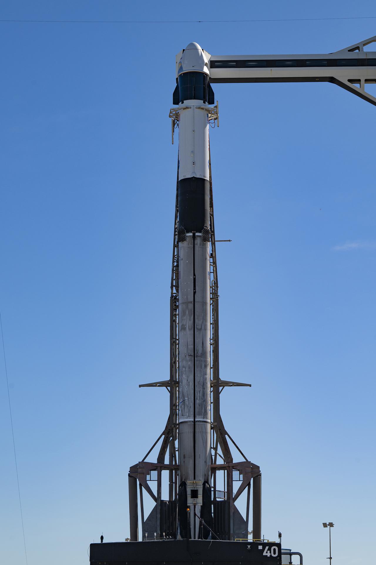 Ahead of launch of NASA’s SpaceX Crew-13 mission, a SpaceX Falcon 9 rocket, with the Dragon spacecraft atop, is vertical at the launch pad of Space Launch Complex 40 at Cape Canaveral Space Force Station in Florida on Sunday, Sept. 27, 2026. NASA astronauts Jessica Watkins and Luke Delaney, CSA (Canadian Space Agency) astronaut Joshua Kutryk, and Roscosmos cosmonaut Sergey Teteryatnikov are scheduled to launch at 11:10 a.m. EDT on Thursday, Oct. 1 to the International Space Station for the 13th crew rotation mission as part of NASA’s Commercial Crew Program. 