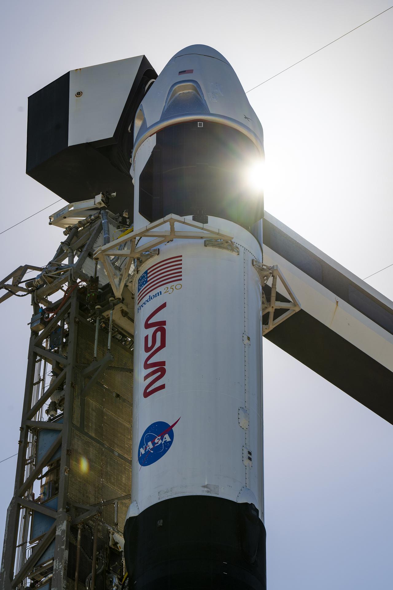 Ahead of launch of NASA’s SpaceX Crew-13 mission, a SpaceX Falcon 9 rocket, with the Dragon spacecraft atop, is vertical at the launch pad of Space Launch Complex 40 at Cape Canaveral Space Force Station in Florida on Sunday, Sept. 27, 2026. NASA astronauts Jessica Watkins and Luke Delaney, CSA (Canadian Space Agency) astronaut Joshua Kutryk, and Roscosmos cosmonaut Sergey Teteryatnikov are scheduled to launch at 11:10 a.m. EDT on Thursday, Oct. 1 to the International Space Station for the 13th crew rotation mission as part of NASA’s Commercial Crew Program. 