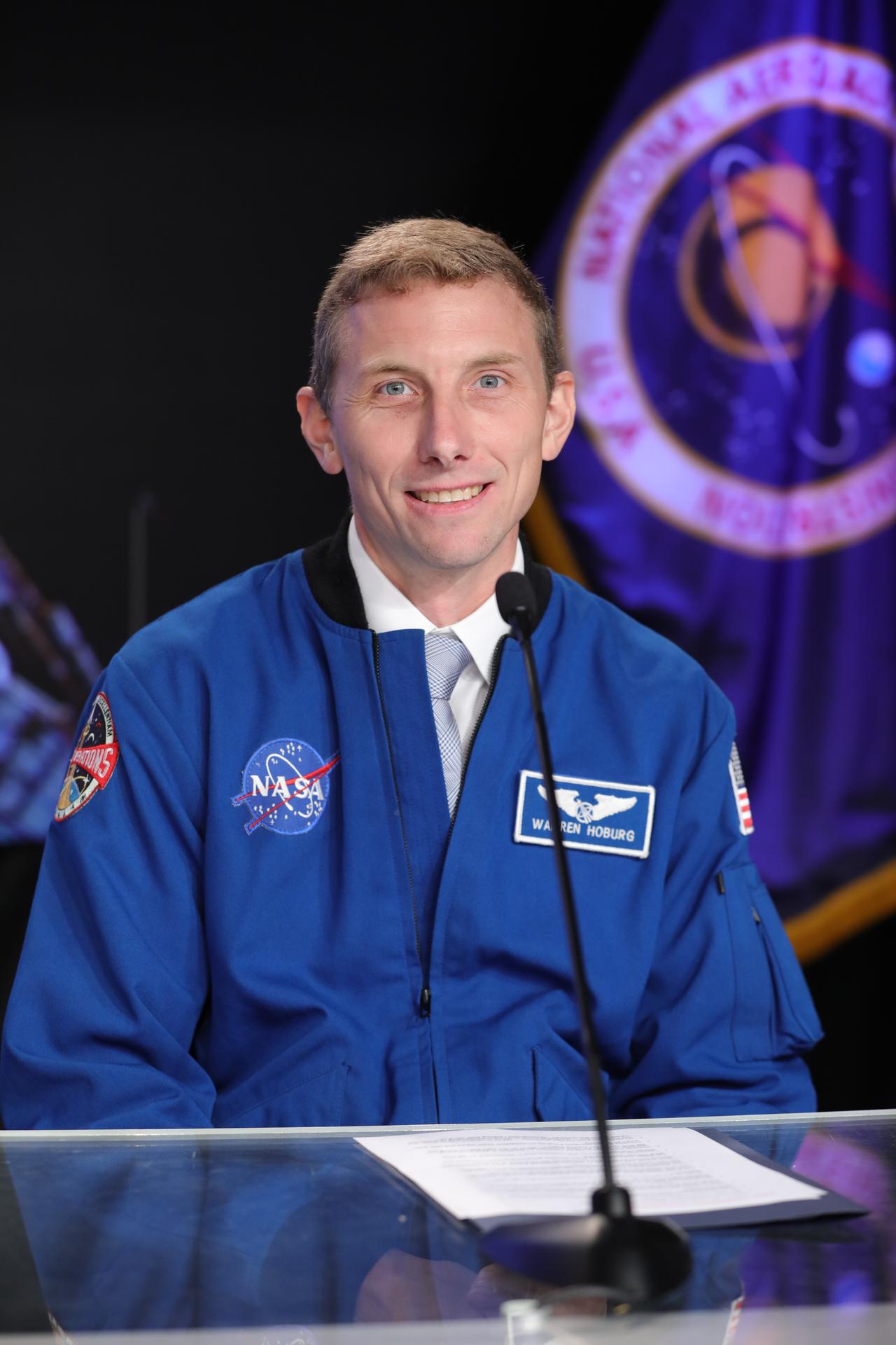Woody Hoburg, NASA astronaut, and commander of the Starliner’s next crewed mission, participates in a news conference with NASA and Boeing leadership to discuss Starliner’s development and plans for regular crew flights to and from the International Space Station during a news conference Monday, Sept. 28, 2026, inside the John Holliman Auditorium of the NASA News Center at the agency’s Kennedy Space Center in Florida.