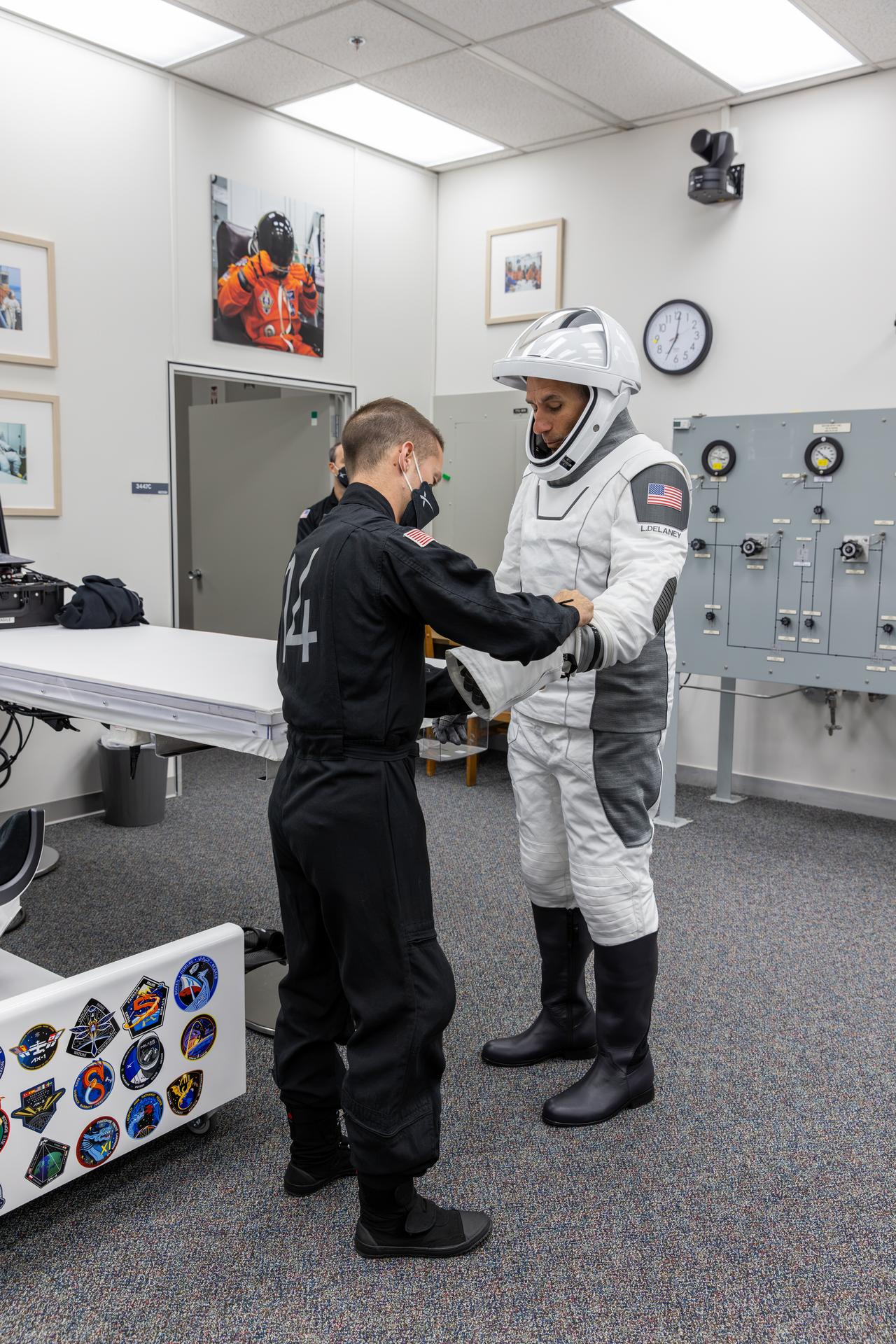 NASA astronaut Luke Delaney conducts leak checks for his SpaceX spacesuit inside the crew suit-up room in the Neil A. Armstrong Operations and Checkout Building at the agency’s Kennedy Space Center in Florida ahead of launch of NASA’s SpaceX Crew-13 mission to the International Space Station on Thursday, Oct. 1, 2026. Delaney and fellow NASA astronaut Jesssica Watkins, along with CSA (Canadian Space Agency) astronaut Joshua Kutryk, and Roscosmos cosmonaut Sergey Teteryatnikov are scheduled to lift off aboard SpaceX’s Dragon spacecraft and Falcon 9 rocket no earlier than 11:10 a.m. EDT, from Space Launch Complex 40 at Cape Canaveral Space Force Station in Florida.