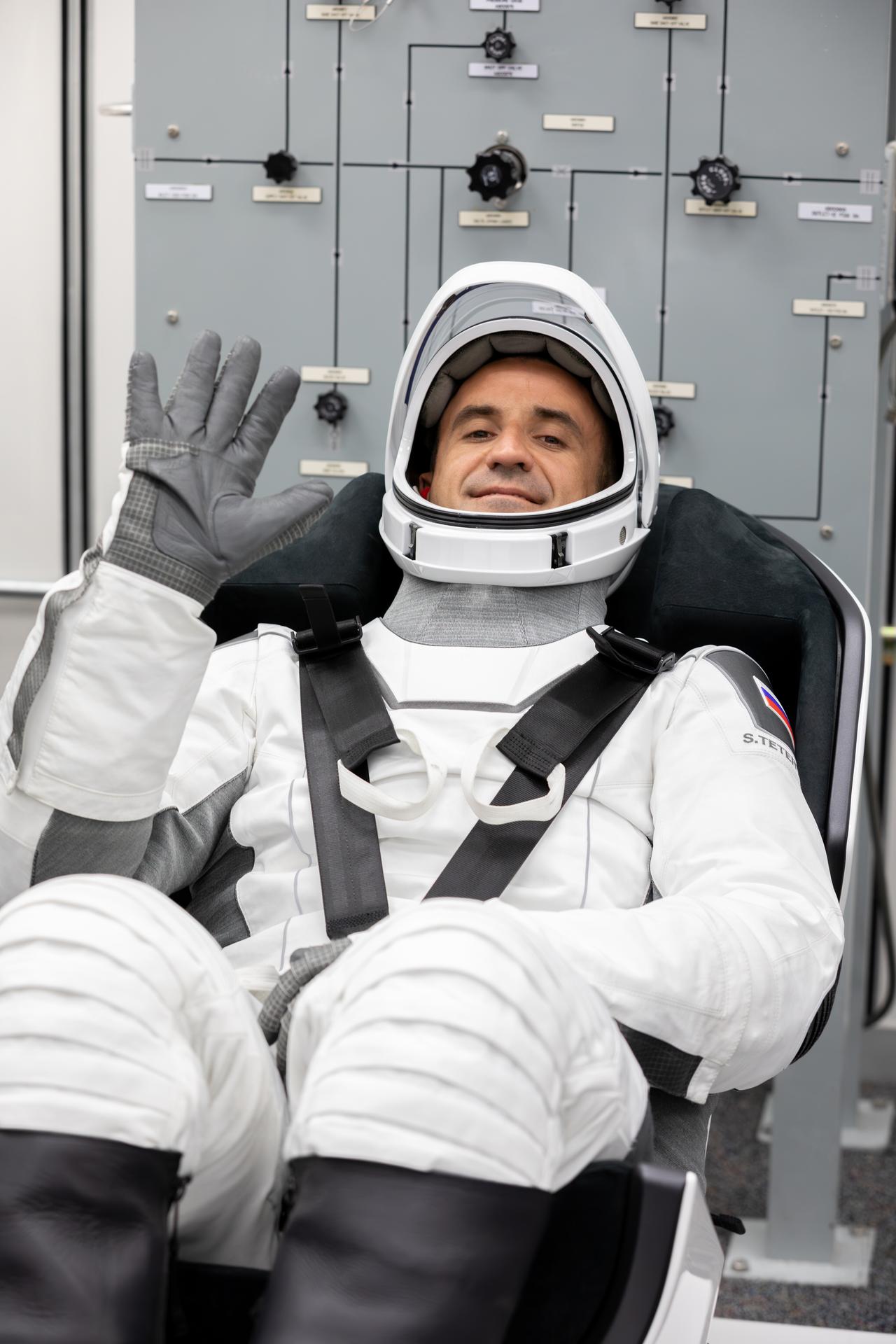 Roscosmos cosmonaut Sergey Teteryatnikov conducts leak checks for his SpaceX spacesuit inside the crew suit-up room in the Neil A. Armstrong Operations and Checkout Building at the agency’s Kennedy Space Center in Florida ahead of launch of NASA’s SpaceX Crew-13 mission to the International Space Station on Thursday, Oct. 1, 2026. NASA astronauts Jessica Watkins and Luke Delaney, CSA (Canadian Space Agency) astronaut Joshua Kutryk, and Teteryatnikov are scheduled to lift off aboard SpaceX’s Dragon spacecraft and Falcon 9 rocket no earlier than 11:10 a.m. EDT, from Space Launch Complex 40 at Cape Canaveral Space Force Station in Florida.