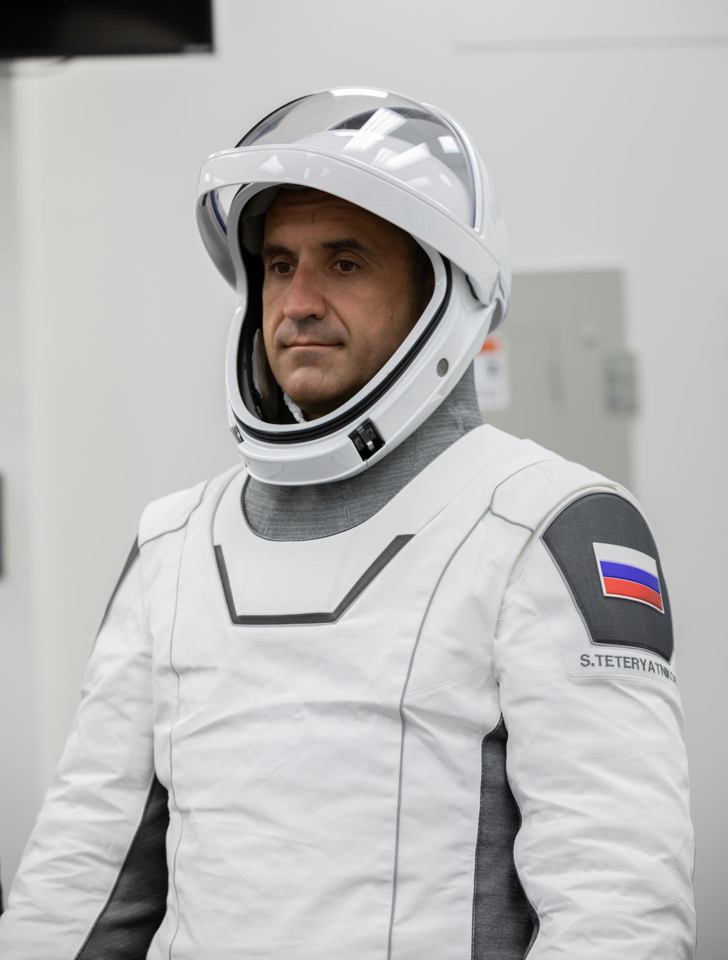 Roscosmos cosmonaut Sergey Teteryatnikov conducts leak checks for his SpaceX spacesuit inside the crew suit-up room in the Neil A. Armstrong Operations and Checkout Building at the agency’s Kennedy Space Center in Florida ahead of launch of NASA’s SpaceX Crew-13 mission to the International Space Station on Thursday, Oct. 1, 2026. NASA astronauts Jessica Watkins and Luke Delaney, CSA (Canadian Space Agency) astronaut Joshua Kutryk, and Teteryatnikov are scheduled to lift off aboard SpaceX’s Dragon spacecraft and Falcon 9 rocket no earlier than 11:10 a.m. EDT, from Space Launch Complex 40 at Cape Canaveral Space Force Station in Florida.