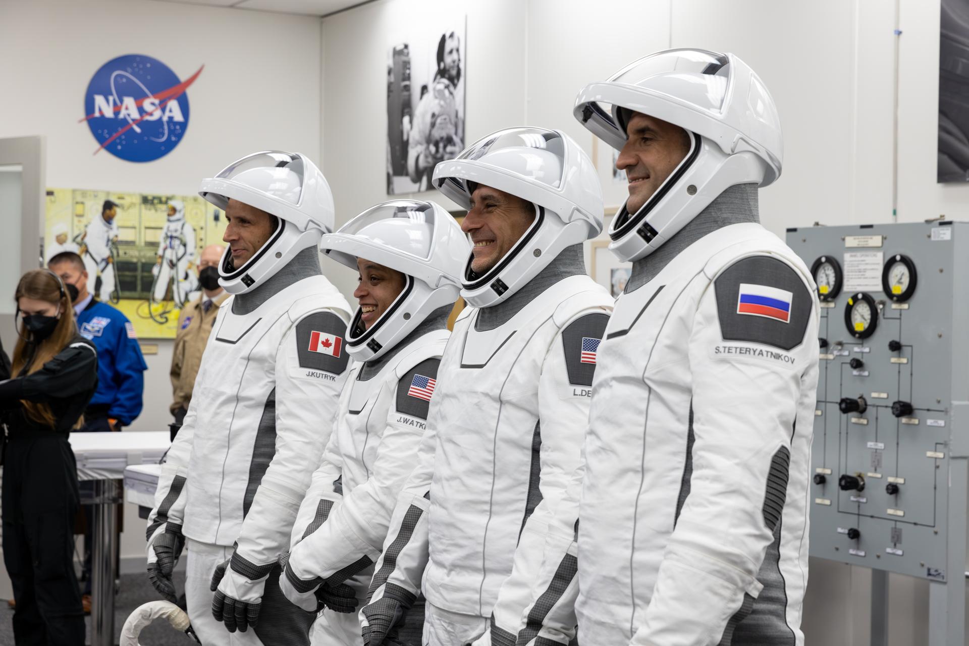 NASA’s SpaceX Crew-13 members pose for a photograph following the completion of suit leak checks in the Neil A. Armstrong Operations and Checkout Building at the agency’s Kennedy Space Center in Florida ahead of launch to the International Space Station on Thursday, Oct. 1, 2026. From left to right, CSA (Canadian Space Agency) astronaut Joshua Kutryk, and NASA astronauts Jessica Watkins and Luke Delaney, along with Roscosmos cosmonaut Sergey Teteryatnikov are scheduled to lift off aboard SpaceX’s Dragon spacecraft and Falcon 9 rocket no earlier than 11:10 a.m. EDT, from Space Launch Complex 40 at Cape Canaveral Space Force Station in Florida.