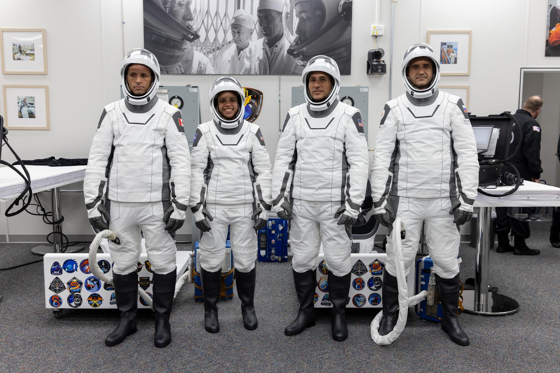 From left to right, NASA’s SpaceX Crew-13 members, from left to right, CSA (Canadian Space Agency) astronaut Joshua Kutryk, and NASA astronauts Jessica Watkins and Luke Delaney, along with Roscosmos cosmonaut Sergey Teteryatnikov, pose for a photograph following the completion of suit leak checks in the Neil A. Armstrong Operations and Checkout Building at the agency’s Kennedy Space Center in Florida ahead of launch to the International Space Station on Thursday, Oct. 1, 2026. Crew-13 is scheduled to lift off aboard SpaceX’s Dragon spacecraft and Falcon 9 rocket no earlier than 11:10 a.m. EDT, from Space Launch Complex 40 at Cape Canaveral Space Force Station in Florida.