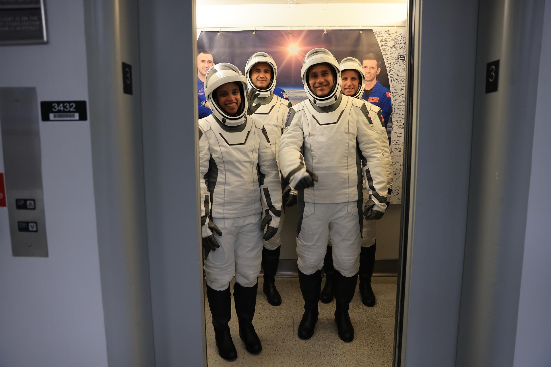 From left to right, NASA astronauts Jessica Watkins and Luke Delaney (front), along with Roscosmos cosmonaut Sergey Teteryatnikov and CSA (Canadian Space Agency) astronaut Joshua Kutryk (back) board the elevator to depart the Neil A. Armstrong Operations and Checkout Building at the agency’s Kennedy Space Center in Florida ahead of the Crew-13 launch on Thursday, Oct. 1, 2026. Crew-13 is scheduled to lift off aboard SpaceX’s Dragon spacecraft and Falcon 9 rocket no earlier than 11:10 a.m. EDT, from Space Launch Complex 40 at Cape Canaveral Space Force Station in Florida.