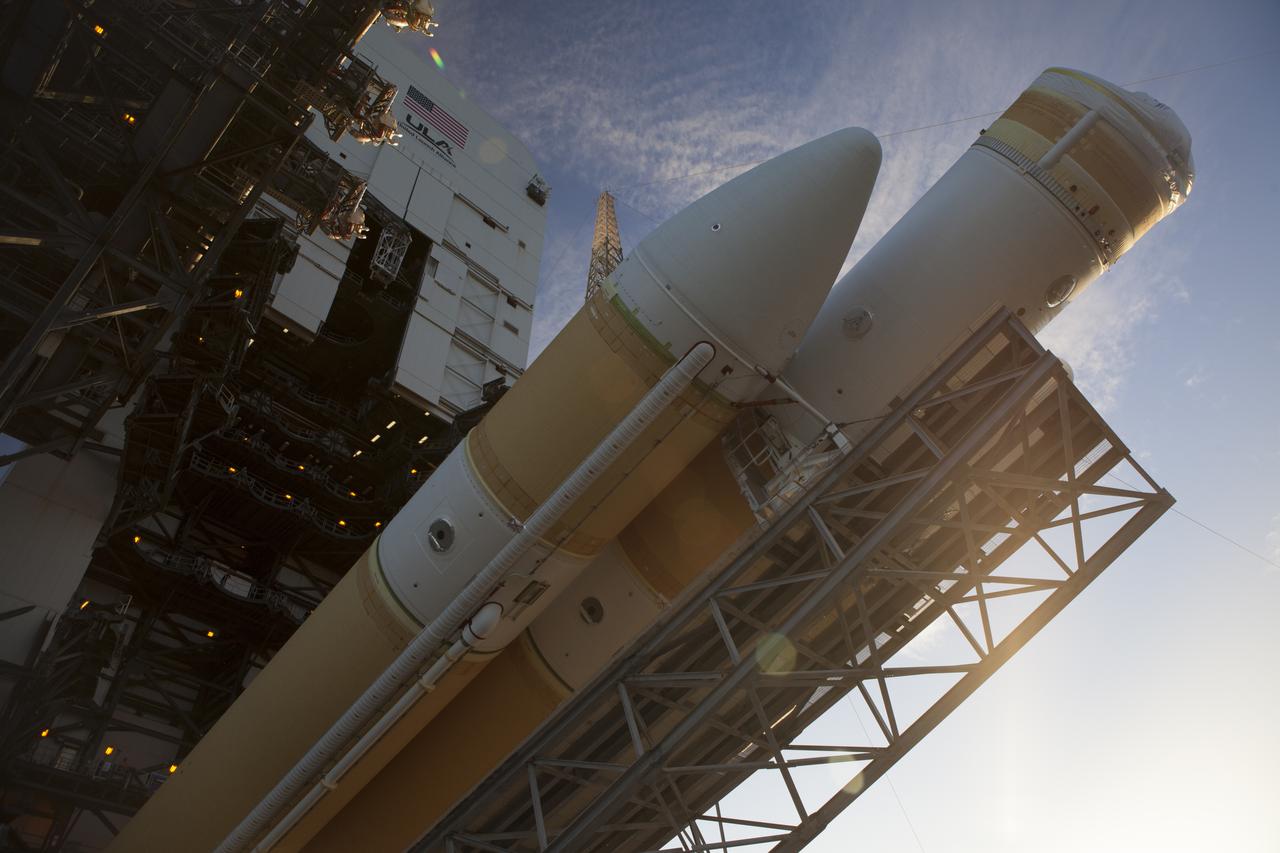 This close-up view shows the United Launch Alliance Delta IV Heavy rocket for Exploration Flight Test-1 being raised into the vertical position at the pad at Space Launch Complex 37 at Cape Canaveral Air Force Station in Florida. The Delta IV Heavy is being readied to launch Orion on its first flight test. During its first flight test, Orion will travel farther into space than any human spacecraft has gone in more than 40 years. The data gathered during the flight will influence design decisions, validate existing computer models and innovative new approaches to space systems development, as well as reduce overall mission risks and costs for later Orion flights. Liftoff of Orion on the first flight test is planned for December 2014.