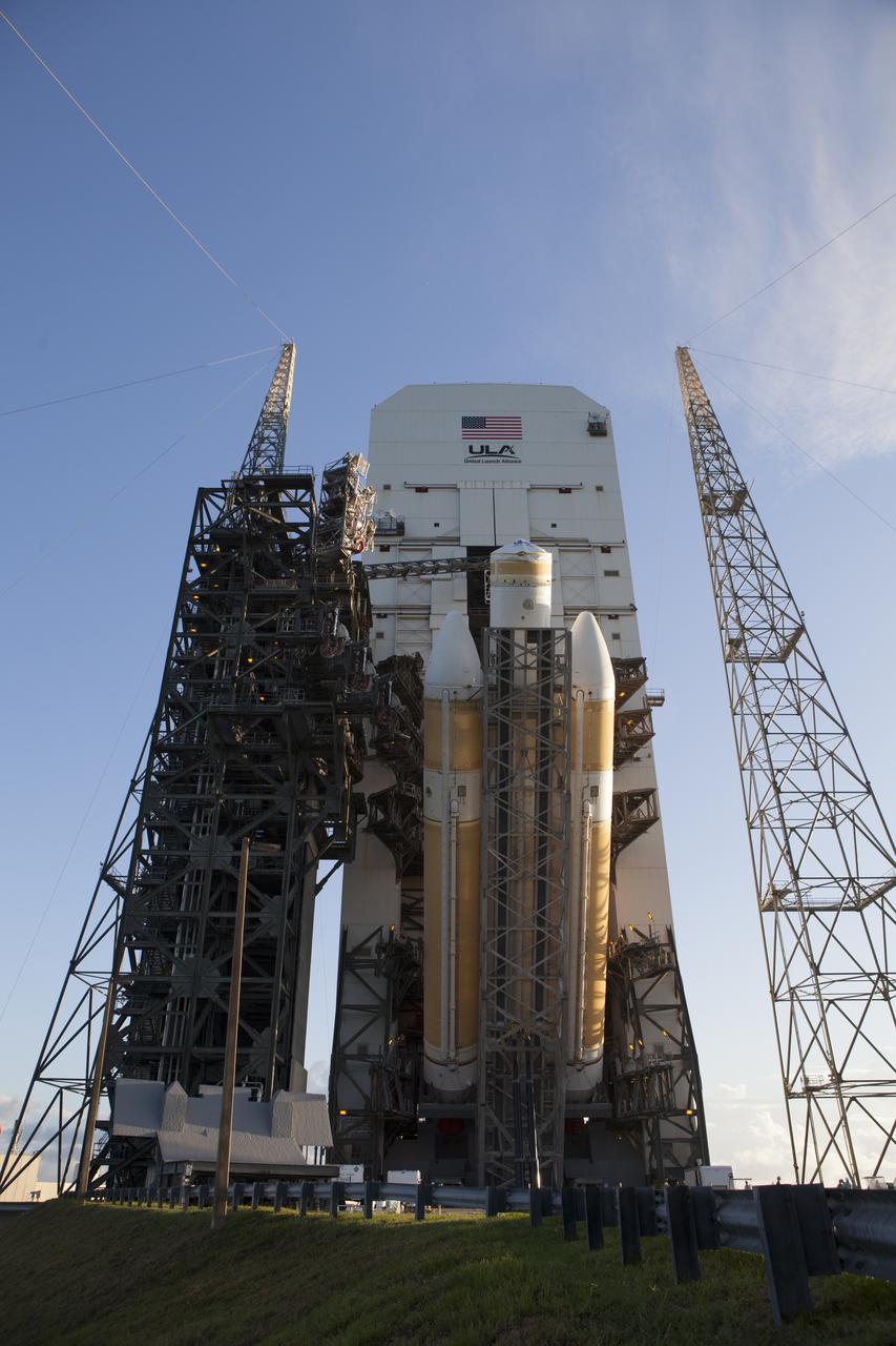 The United Launch Alliance Delta IV Heavy rocket for Exploration Flight Test-1 is being lifted to the vertical position in the mobile service tower on the pad at the pad at Space Launch Complex 37 at Cape Canaveral Air Force Station in Florida. The Delta IV Heavy is being readied to launch Orion on its first flight test. During its first flight test, Orion will travel farther into space than any human spacecraft has gone in more than 40 years. The data gathered during the flight will influence design decisions, validate existing computer models and innovative new approaches to space systems development, as well as reduce overall mission risks and costs for later Orion flights. Liftoff of Orion on the first flight test is planned for December 2014.