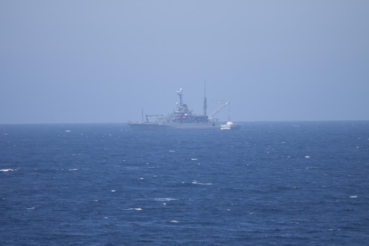 During Orion Underway Recovery Test 4A aboard the USNS Salvor, a safeguard-class rescue and salvage ship, a crane is used to lift the Orion boilerplate test vehicle. Orion will be lifted up and lowered into the water to test crew module crane recovery operations. NASA, Lockheed Martin and the U.S. Navy are conducting the test in the Pacific Ocean to prepare for recovery of the Orion crew module on its return from a deep space mission. The test allows the teams to demonstrate and evaluate the recovery processes, procedures, hardware and personnel in open waters. The Ground Systems Development and Operations Program is conducting the underway recovery tests. Orion is the exploration spacecraft designed to carry astronauts to destinations not yet explored by humans, including an asteroid and Mars. It will have emergency abort capability, sustain the crew during space travel and provide safe re-entry from deep space return velocities. The first unpiloted test flight of Orion is scheduled to launch in 2014 atop a United Launch Alliance Delta IV Heavy rocket and in 2018 on NASA’s Space Launch System rocket.