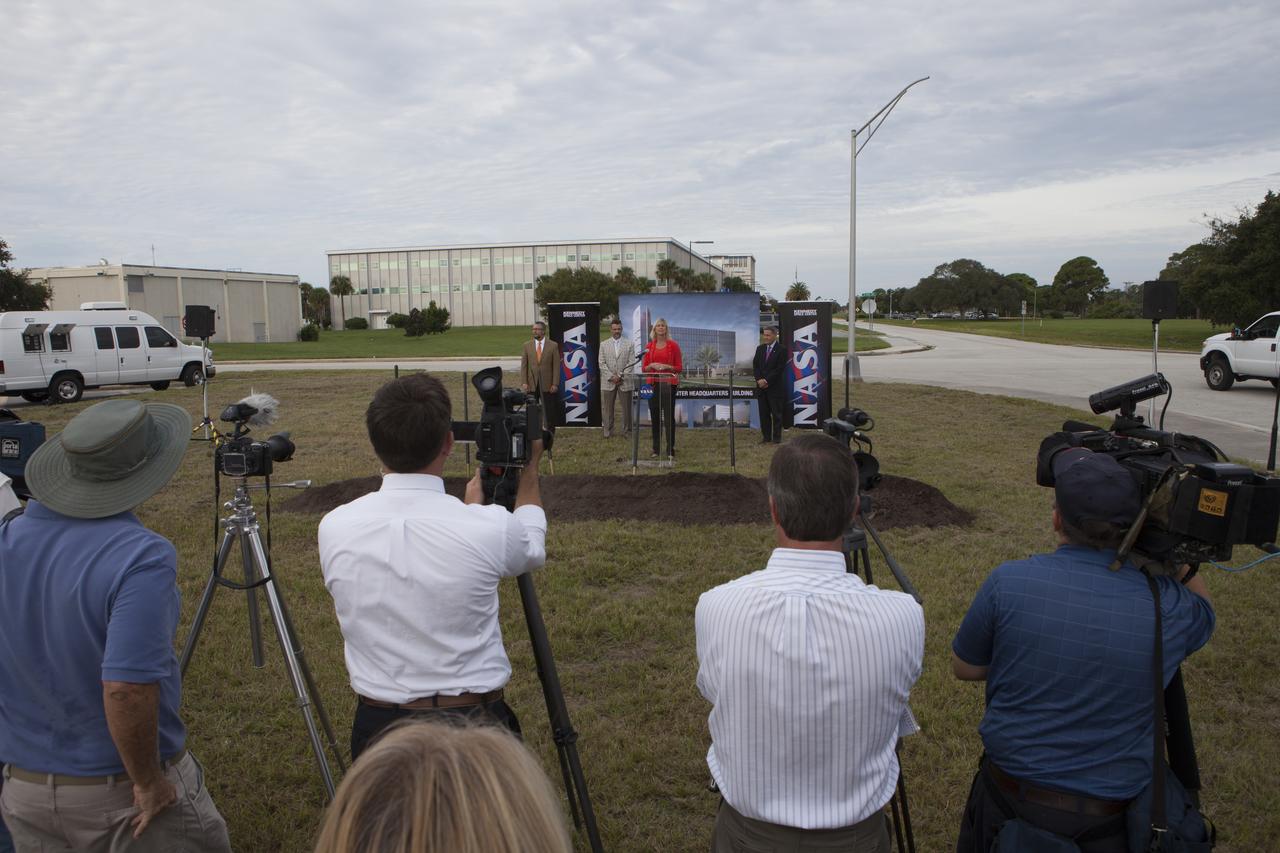 Groundbreaking for the new Central Campus took place in the Industrial Area at NASA's Kennedy Space Center in Florida. Nancy Bray, director of Kennedy's Center Operations Directorate, speaks to members of the media and guests during the ceremony. To her right is Kennedy Center Director Bob Cabana. From far left, are Steve Belflower, vice president of HuntonBrady Architects of Orlando, and Kirk Hazen, southeast district manager and vice president of Hensel Phelps, the construction contractor. Kennedy is transforming into a multi-user, 21st century spaceport supporting both commercial and government users and operations. Central Campus Phase I includes construction of a new Headquarters Building as one of the major components of the strategy. The new Headquarters Building will be a seven-story, 200,000-square-foot facility that will house about 500 NASA civil service and contractor employees.