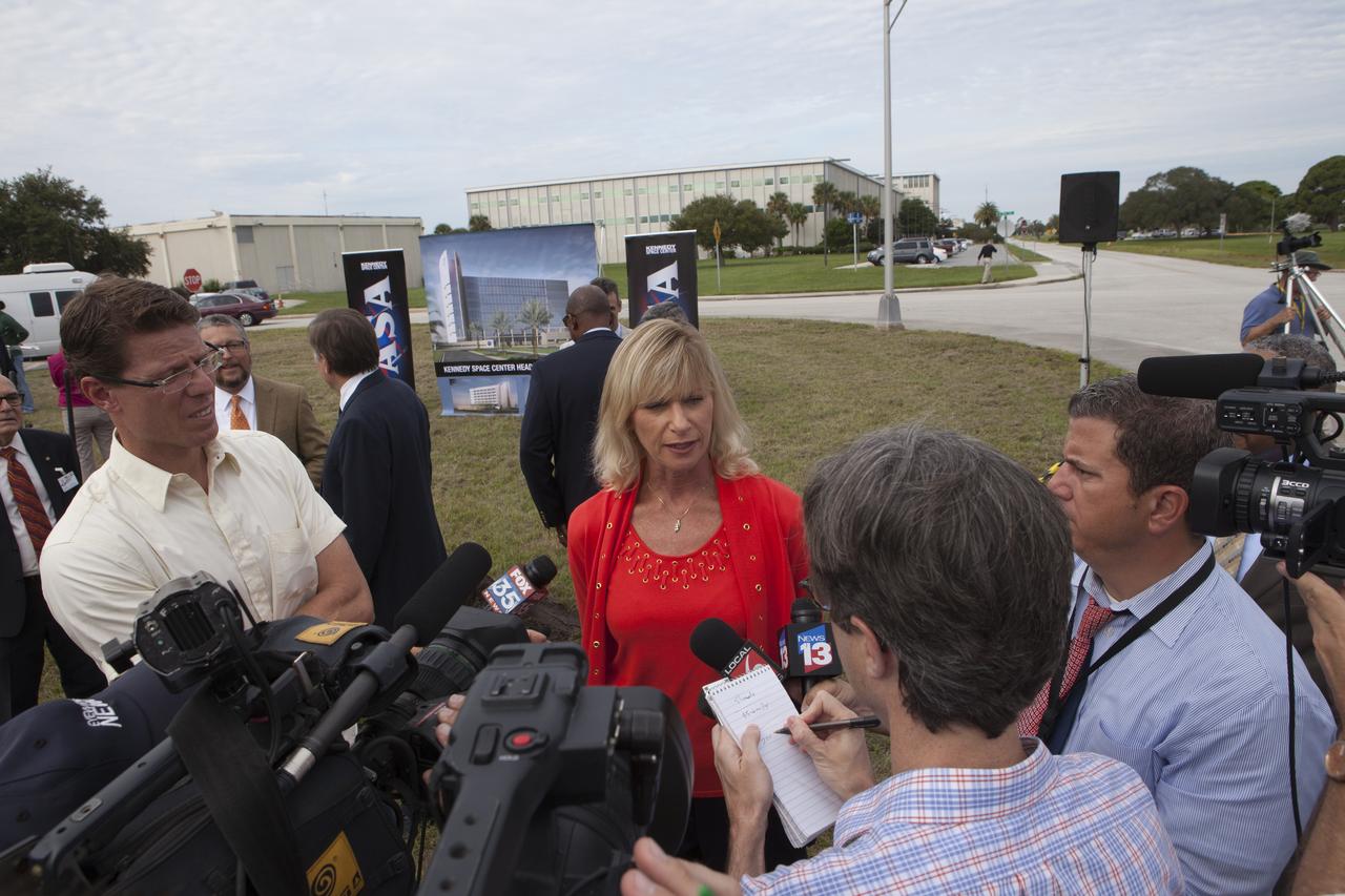 Groundbreaking for the new Central Campus will take place in the Industrial Area at NASA's Kennedy Space Center in Florida. Nancy Bray, director of Kennedy's Center Operations Directorate, is interviewed by members of the media during the groundbreaking ceremony. Kennedy is transforming into a multi-user, 21st century spaceport supporting both commercial and government users and operations. Central Campus Phase I includes construction of a new Headquarters Building as one of the major components of the strategy. The new Headquarters Building will be a seven-story, 200,000-square-foot facility that will house about 500 NASA civil service and contractor employees.