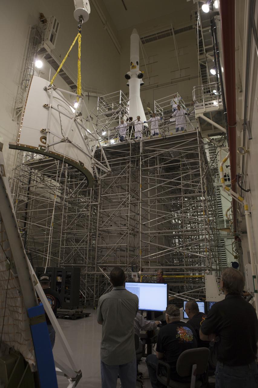 The first of four Ogive panels is lifted by crane for installation on Orion's Launch Abort System inside the Launch Abort System Facility at NASA’s Kennedy Space Center in Florida. The panels will smooth the airflow over the conical spacecraft to limit sound and vibration, which will make for a much smoother ride for the astronauts who will ride inside Orion in the future. The work marked the final major assembly steps for the spacecraft before it is transported to Space Launch Complex 37 at Cape Canaveral Air Force Station in November. Orion is the exploration spacecraft designed to carry astronauts to destinations not yet explored by humans, including an asteroid and Mars. It will have emergency abort capability, sustain the crew during space travel and provide safe re-entry from deep space return velocities. The first unpiloted flight test of Orion is scheduled to launch in December 2014 atop a United Launch Alliance Delta IV Heavy rocket, and in 2018 on NASA’s Space Launch System rocket.