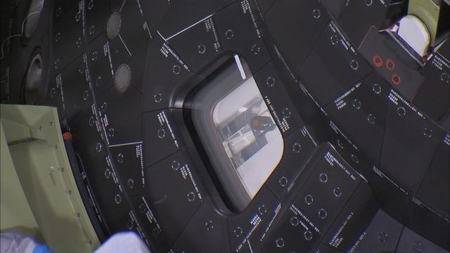 Inside the Launch Abort System Facility at NASA’s Kennedy Space Center in Florida, a window cover has been carefully removed from the Orion spacecraft before the fourth and final Ogive panel is installed around the spacecraft and Launch Abort System. The Ogive panels will smooth the airflow over the conical spacecraft to limit sound and vibration, which will make for a much smoother ride for the astronauts who will ride inside Orion in the future. The work marked the final major assembly steps for the spacecraft before it is transported to Space Launch Complex 37 at Cape Canaveral Air Force Station in November. Orion is the exploration spacecraft designed to carry astronauts to destinations not yet explored by humans, including an asteroid and Mars. It will have emergency abort capability, sustain the crew during space travel and provide safe re-entry from deep space return velocities. The first unpiloted flight test of Orion is scheduled to launch in December 2014 atop a United Launch Alliance Delta IV Heavy rocket, and in 2018 on NASA’s Space Launch System rocket.