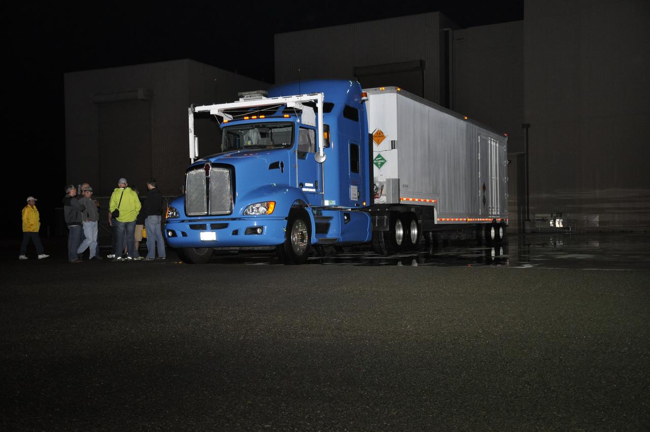 The truck transporting NASA's Soil Moisture Active Passive, or SMAP, spacecraft arrives at the Astrotech payload processing facility on Vandenberg Air Force Base in California. SMAP will launch on a Delta II 7320 configuration vehicle featuring a United Launch Alliance first stage booster powered by an Aerojet Rocketdyne RS-27A main engine and three Alliant Techsystems, or ATK, strap-on solid rocket motors. Once on station in Earth orbit, SMAP will provide global measurements of soil moisture and its freeze/thaw state. These measurements will be used to enhance understanding of processes that link the water, energy and carbon cycles, and to extend the capabilities of weather and climate prediction models. SMAP data also will be used to quantify net carbon flux in boreal landscapes and to develop improved flood prediction and drought monitoring capabilities. Launch from Space Launch Complex 2 is targeted for Jan. 29, 2015.
