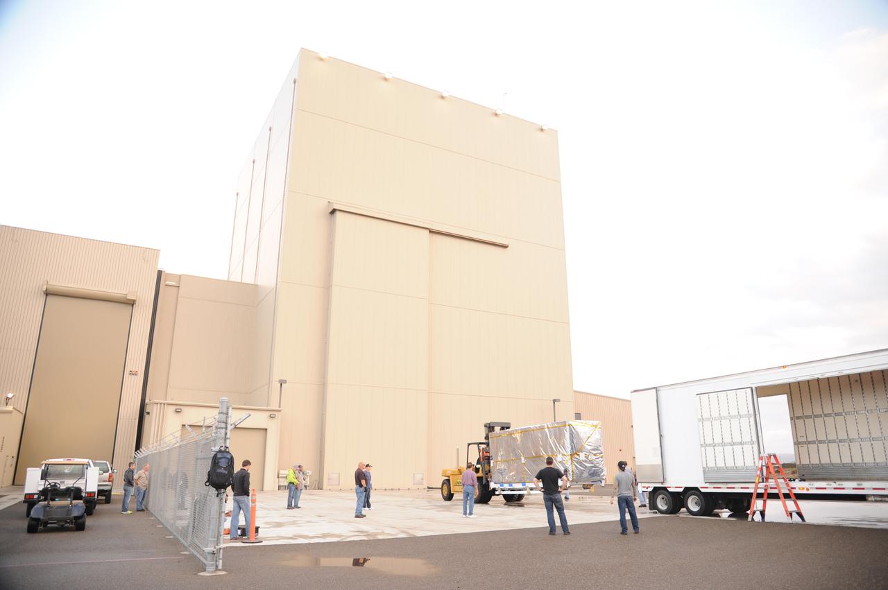 NASA's Soil Moisture Active Passive, or SMAP, spacecraft, enclosed in a transportation container, is offloaded from the truck on which it traveled from the Jet Propulsion Laboratory in Pasadena, California, to the Astrotech payload processing facility on Vandenberg Air Force Base in California. SMAP will launch on a Delta II 7320 configuration vehicle featuring a United Launch Alliance first stage booster powered by an Aerojet Rocketdyne RS-27A main engine and three Alliant Techsystems, or ATK, strap-on solid rocket motors. Once on station in Earth orbit, SMAP will provide global measurements of soil moisture and its freeze/thaw state. These measurements will be used to enhance understanding of processes that link the water, energy and carbon cycles, and to extend the capabilities of weather and climate prediction models. SMAP data also will be used to quantify net carbon flux in boreal landscapes and to develop improved flood prediction and drought monitoring capabilities. Launch from Space Launch Complex 2 is targeted for Jan. 29, 2015.