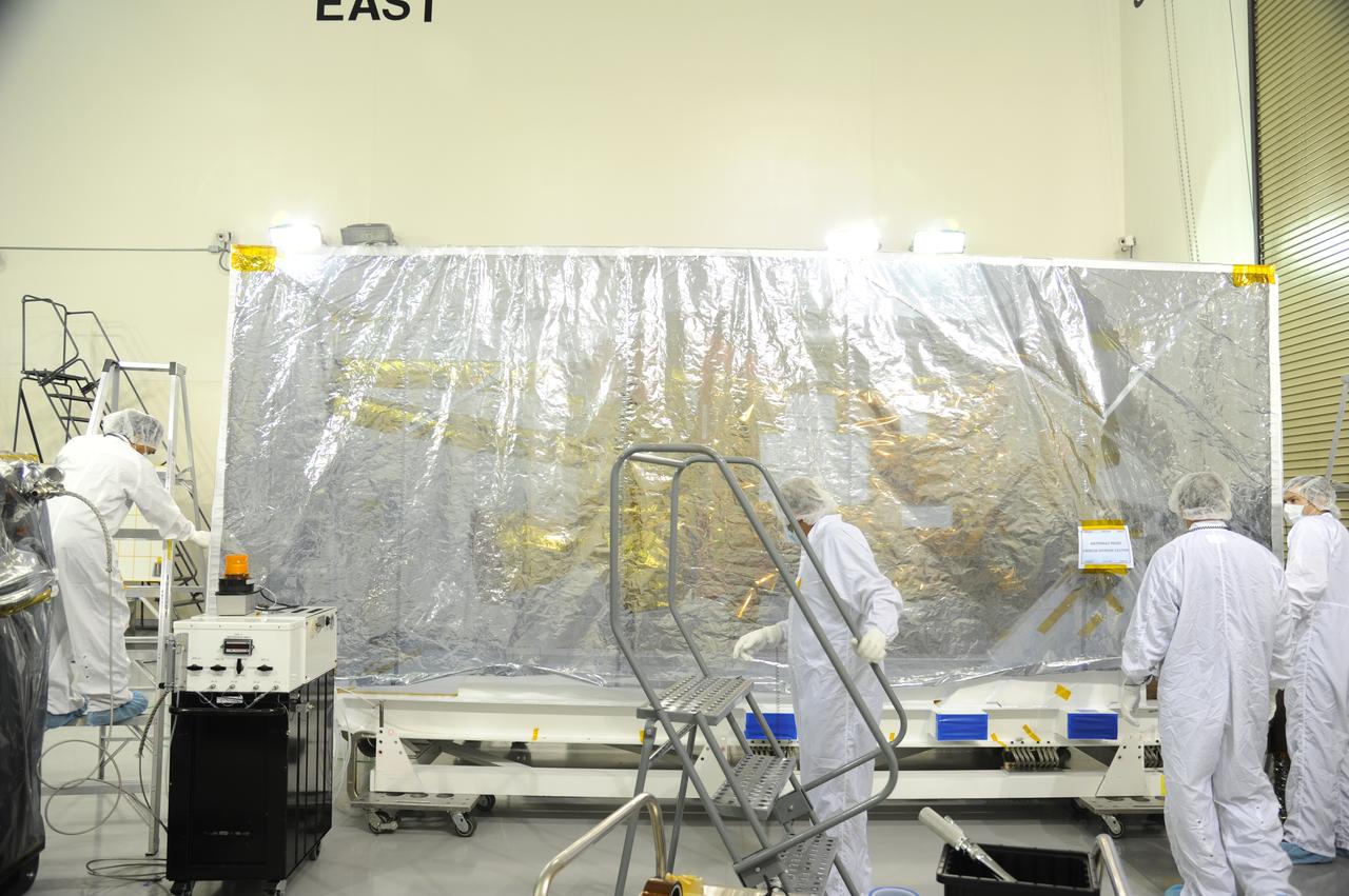 The protective covering has been replaced around NASA's Soil Moisture Active Passive, or SMAP, spacecraft following the spacecraft's post-shipment inspection in the Astrotech payload processing facility on Vandenberg Air Force Base in California. The covering will protect the spacecraft from static-charge buildup and contamination while it awaits further processing. SMAP will launch on a Delta II 7320 configuration vehicle featuring a United Launch Alliance first stage booster powered by an Aerojet Rocketdyne RS-27A main engine and three Alliant Techsystems, or ATK, strap-on solid rocket motors. Once on station in Earth orbit, SMAP will provide global measurements of soil moisture and its freeze/thaw state. These measurements will be used to enhance understanding of processes that link the water, energy and carbon cycles, and to extend the capabilities of weather and climate prediction models. SMAP data also will be used to quantify net carbon flux in boreal landscapes and to develop improved flood prediction and drought monitoring capabilities. Launch from Space Launch Complex 2 is targeted for Jan. 29, 2015.