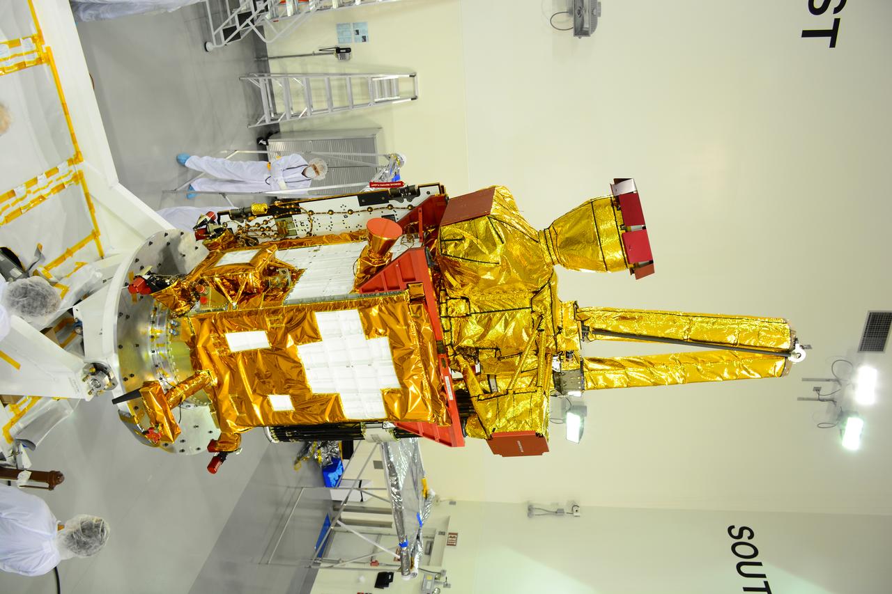 Inside the Astrotech payload processing facility on Vandenberg Air Force Base in California, engineers and technicians rotate NASA's Soil Moisture Active Passive, or SMAP, spacecraft to begin processing. SMAP will launch on a Delta II 7320 configuration vehicle featuring a United Launch Alliance first stage booster powered by an Aerojet Rocketdyne RS-27A main engine and three Alliant Techsystems, or ATK, strap-on solid rocket motors. Once on station in Earth orbit, SMAP will provide global measurements of soil moisture and its freeze/thaw state. These measurements will be used to enhance understanding of processes that link the water, energy and carbon cycles, and to extend the capabilities of weather and climate prediction models. SMAP data also will be used to quantify net carbon flux in boreal landscapes and to develop improved flood prediction and drought monitoring capabilities. Launch from Space Launch Complex 2 is targeted for Jan. 29, 2015.