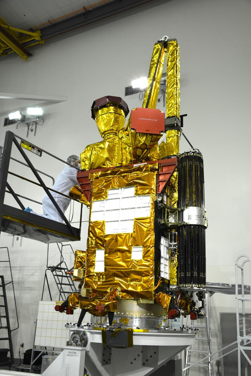 Inside the Astrotech payload processing facility on Vandenberg Air Force Base in California, engineers and technicians have rotated NASA's Soil Moisture Active Passive, or SMAP, spacecraft to begin processing. SMAP will launch on a Delta II 7320 configuration vehicle featuring a United Launch Alliance first stage booster powered by an Aerojet Rocketdyne RS-27A main engine and three Alliant Techsystems, or ATK, strap-on solid rocket motors. Once on station in Earth orbit, SMAP will provide global measurements of soil moisture and its freeze/thaw state. These measurements will be used to enhance understanding of processes that link the water, energy and carbon cycles, and to extend the capabilities of weather and climate prediction models. SMAP data also will be used to quantify net carbon flux in boreal landscapes and to develop improved flood prediction and drought monitoring capabilities. Launch from Space Launch Complex 2 is targeted for Jan. 29, 2015.